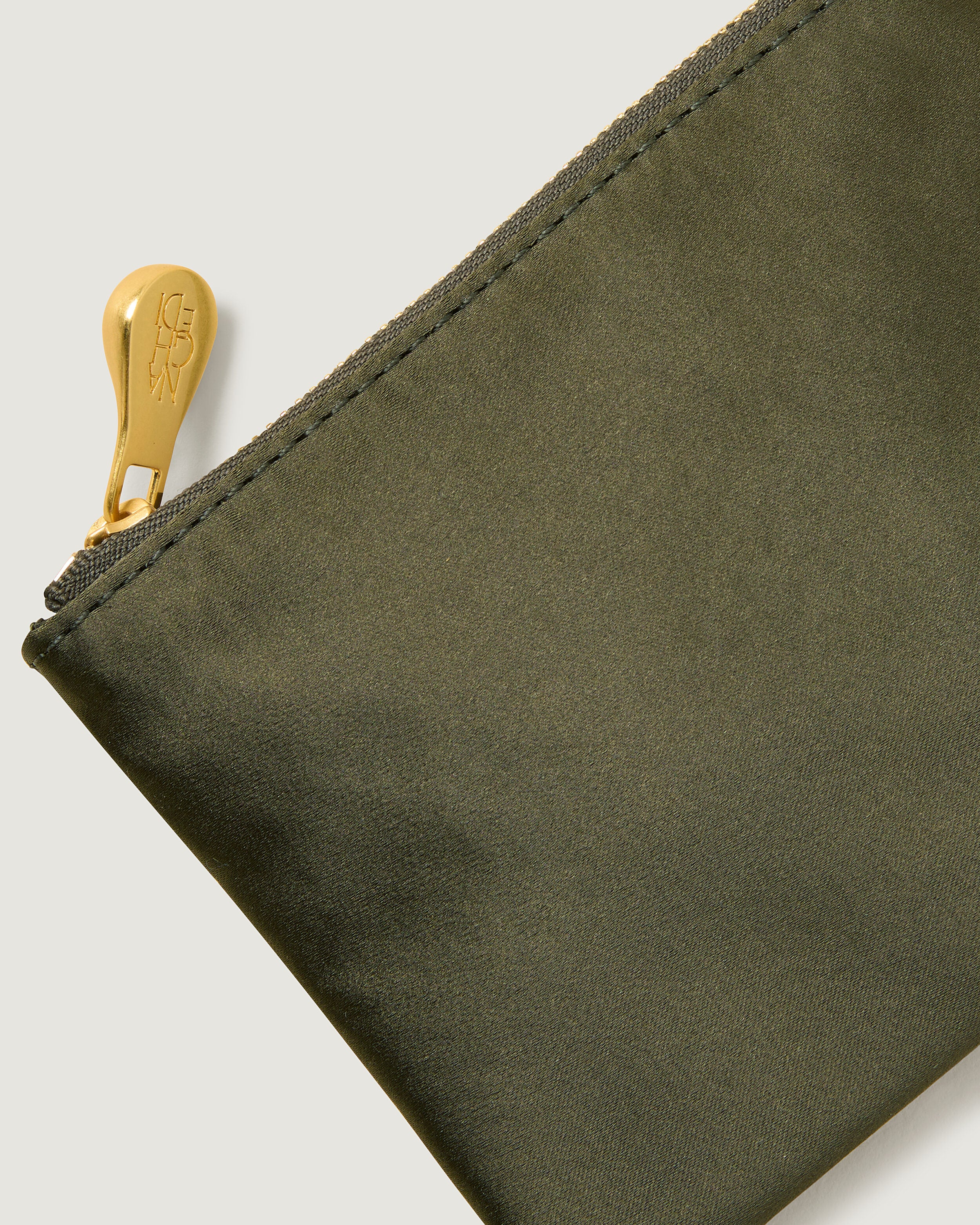 Close-up of included coordinating neoprene zippered pouch.