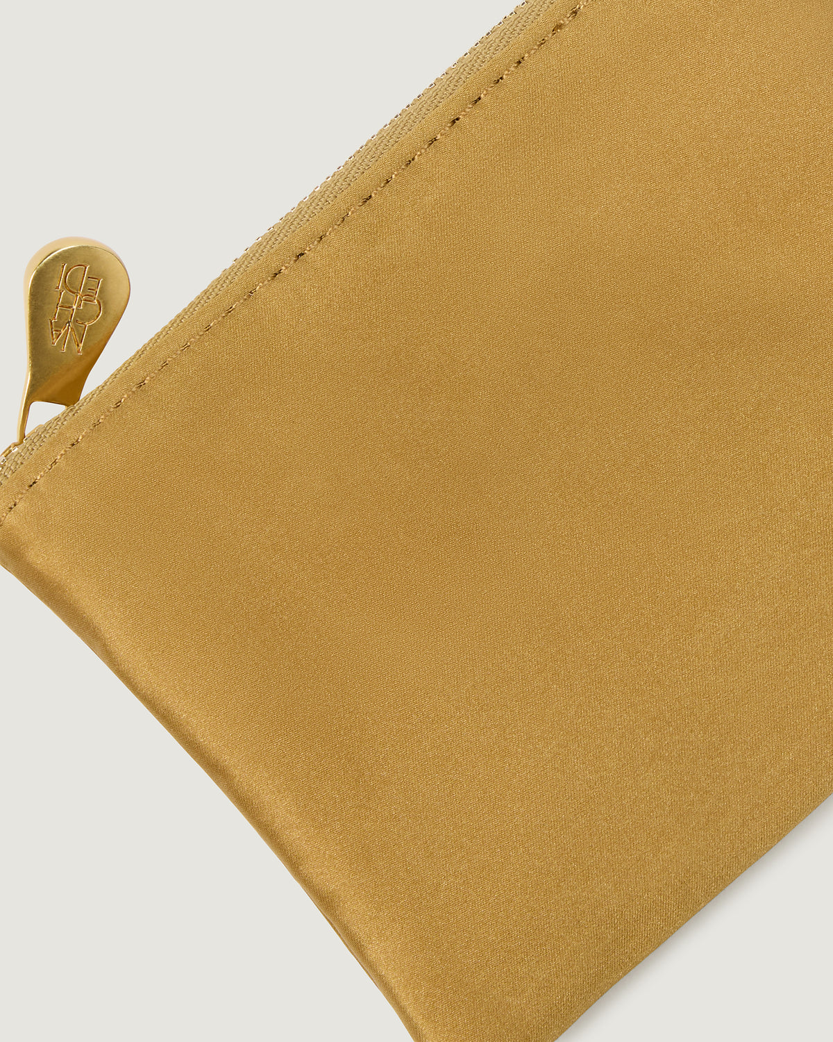 Close-up of included matching woven zippered pouch.