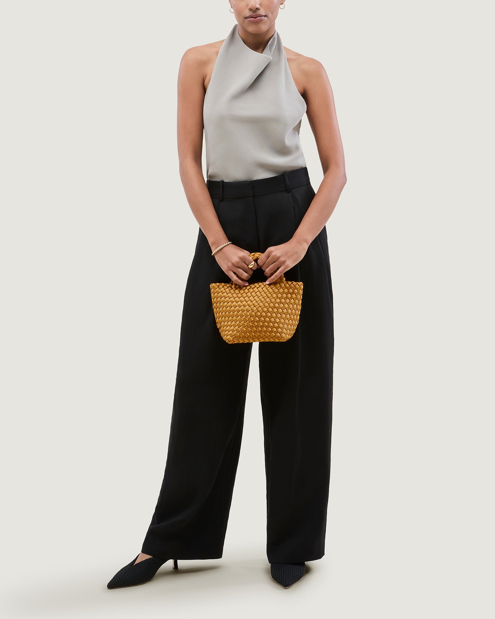 St. Barths Petit Satin Tote Bag in Ore shown on model to illustrate scale and soft silhouette.