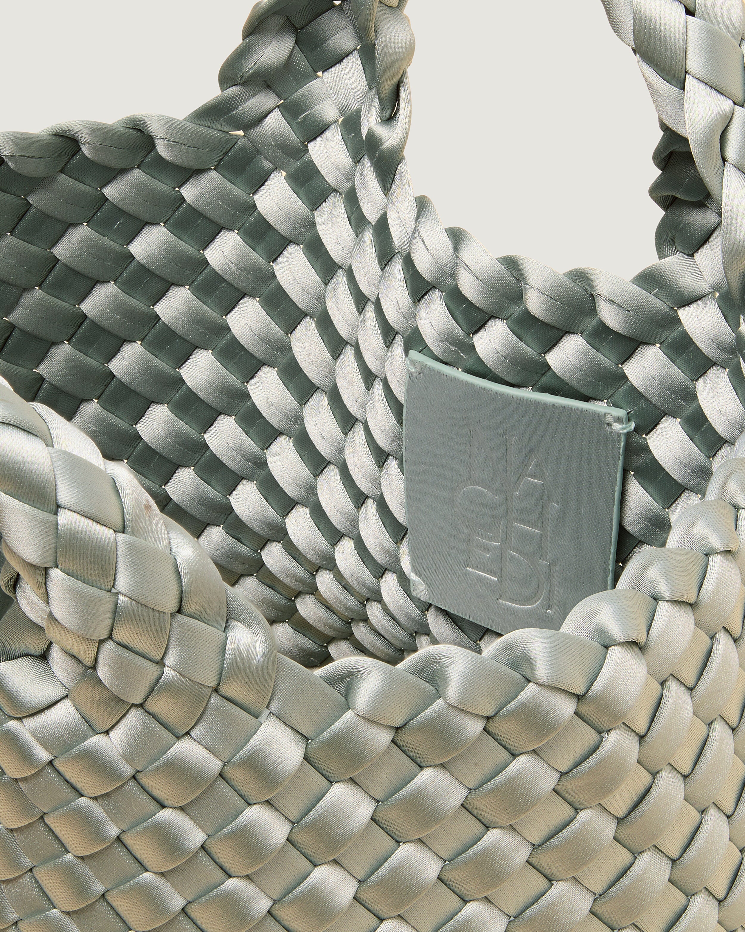 Interior close-up of St. Barths Tote in Wintergreen showing its open top, and unlined interior.