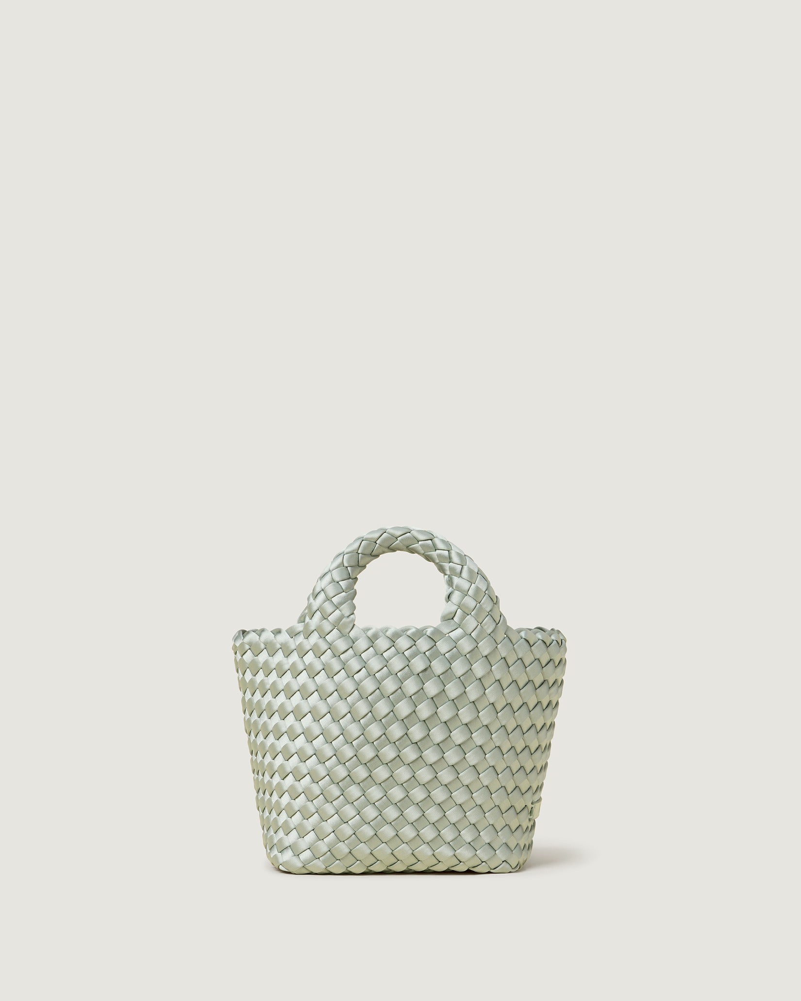 St. Barths Petit Satin Tote Bag in Wintergreen, an aqua green tone, in handwoven neoprene featuring an open top, woven top handles, and detachable, adjustable nylon crossbody strap.