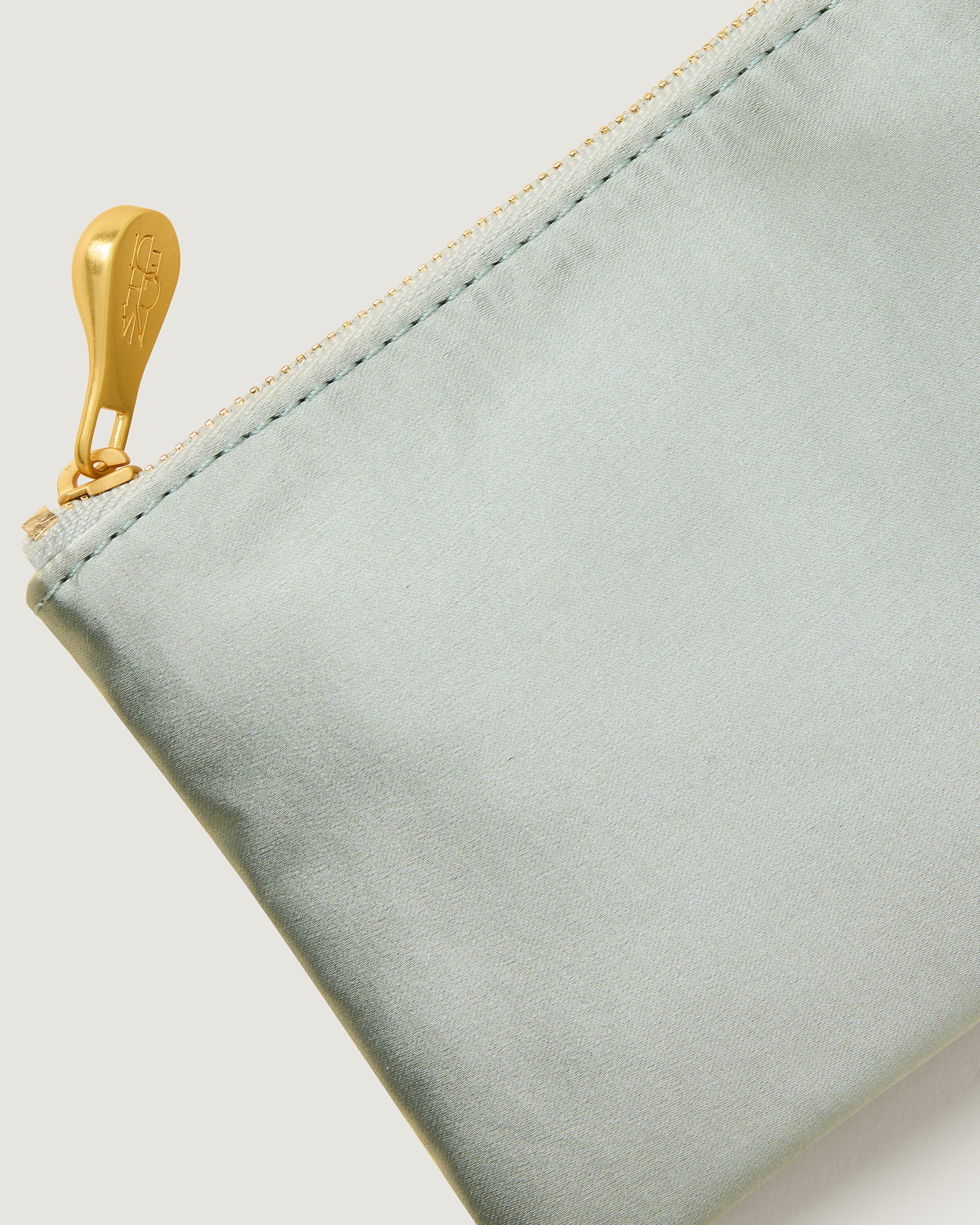 Close-up of included coordinating neoprene zippered pouch.