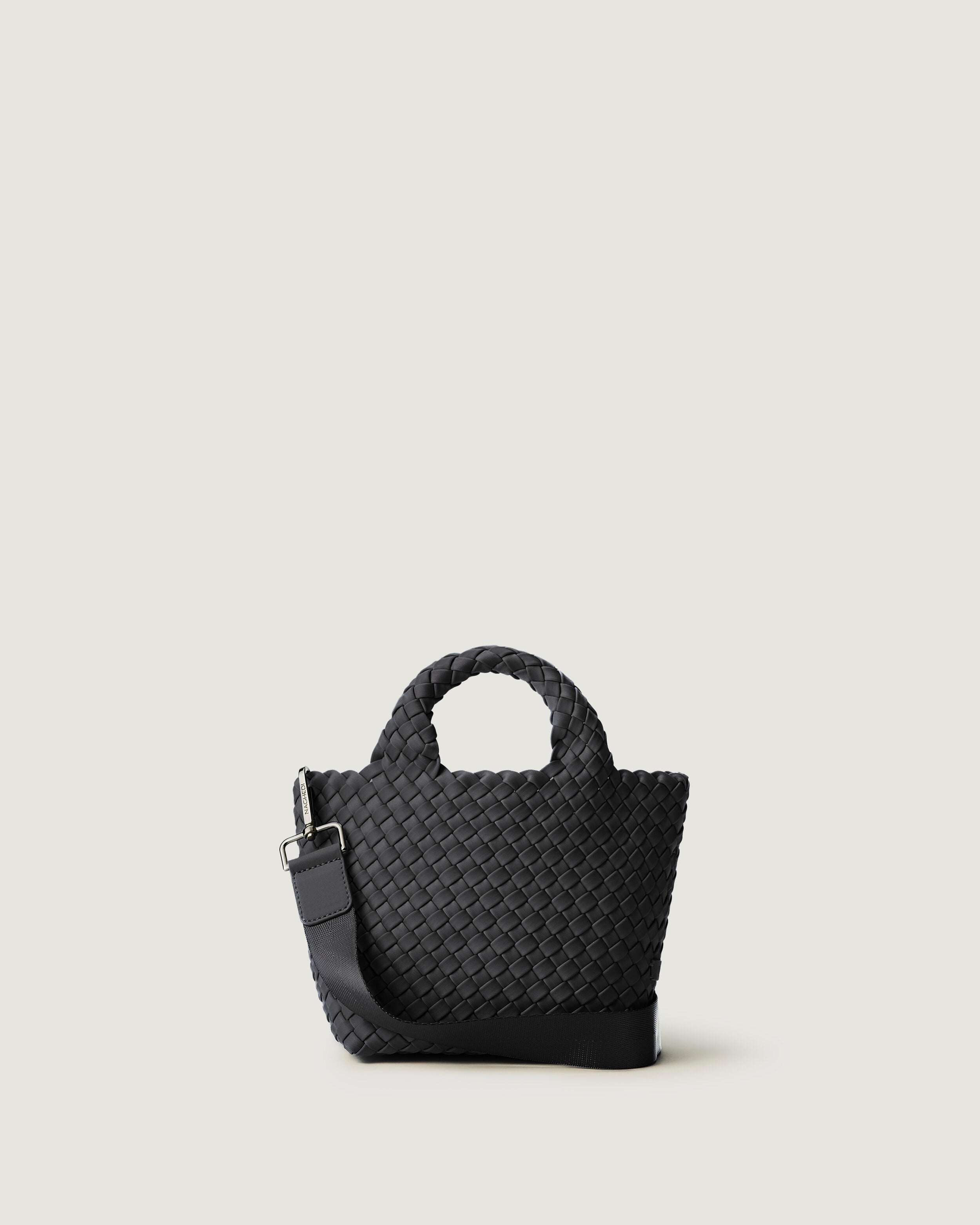 St. Barths Tote in Ash, a slate gray  tone, in handwoven neoprene, featuring an open top, woven top handles, and detachable, adjustable nylon crossbody strap.