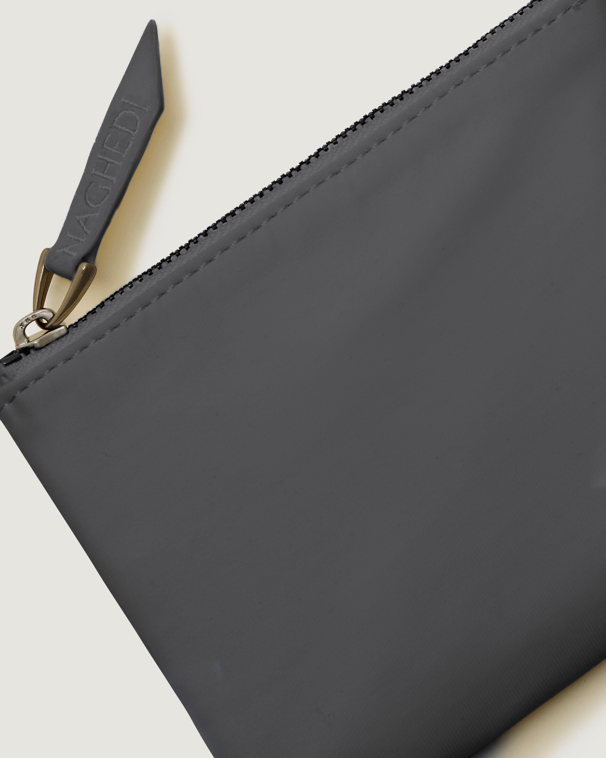 Close-up of included coordinating neoprene zippered pouch.
