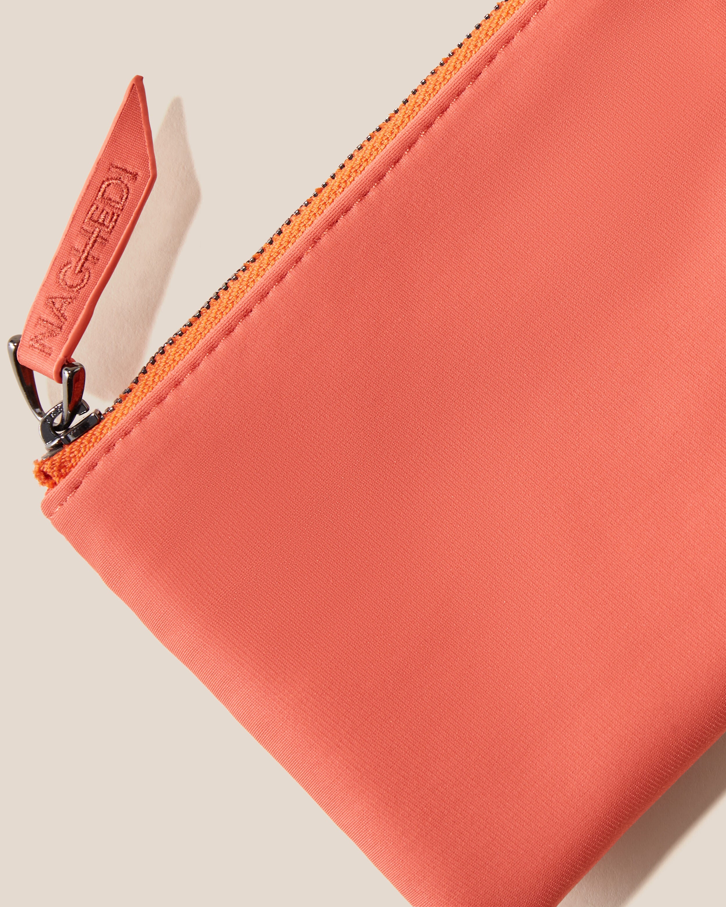 Close-up of included coordinating neoprene zippered pouch.