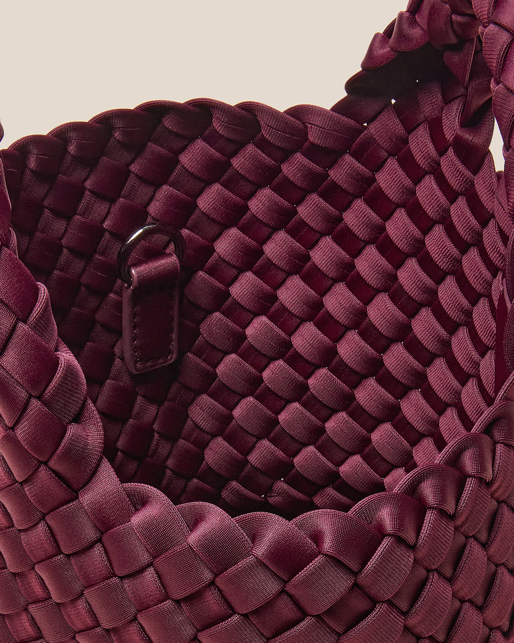 Interior close-up of St. Barths Petit Tote Bag in Bordeaux showing its open top, and unlined interior.