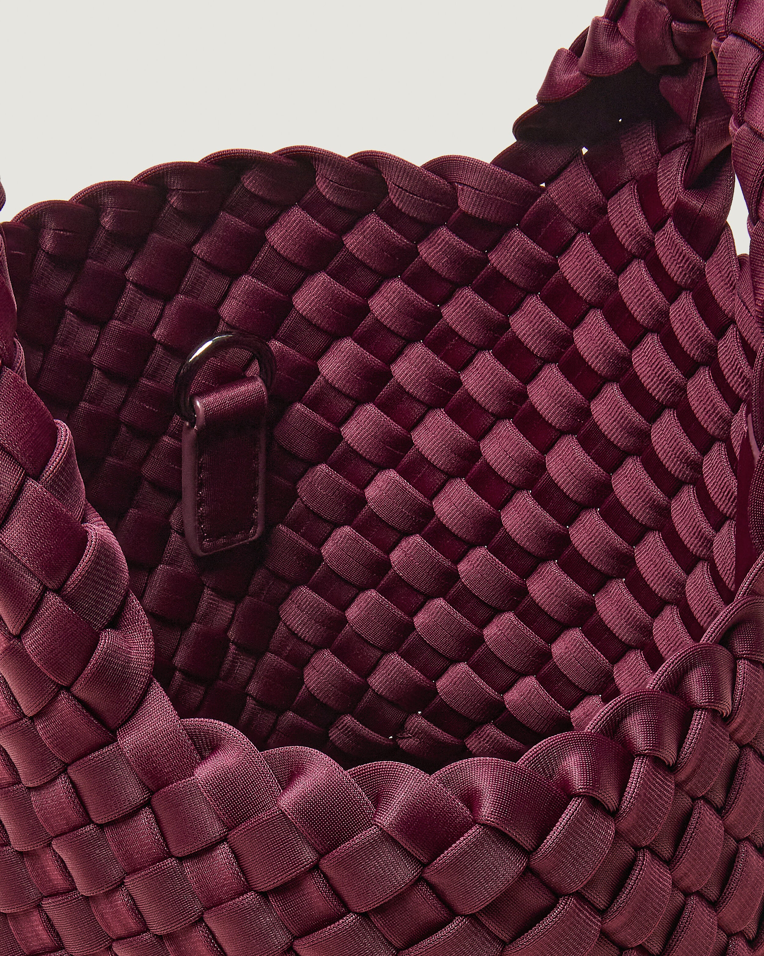 Interior close-up of St. Barths Tote in Bordeaux showing its open top, and unlined interior.