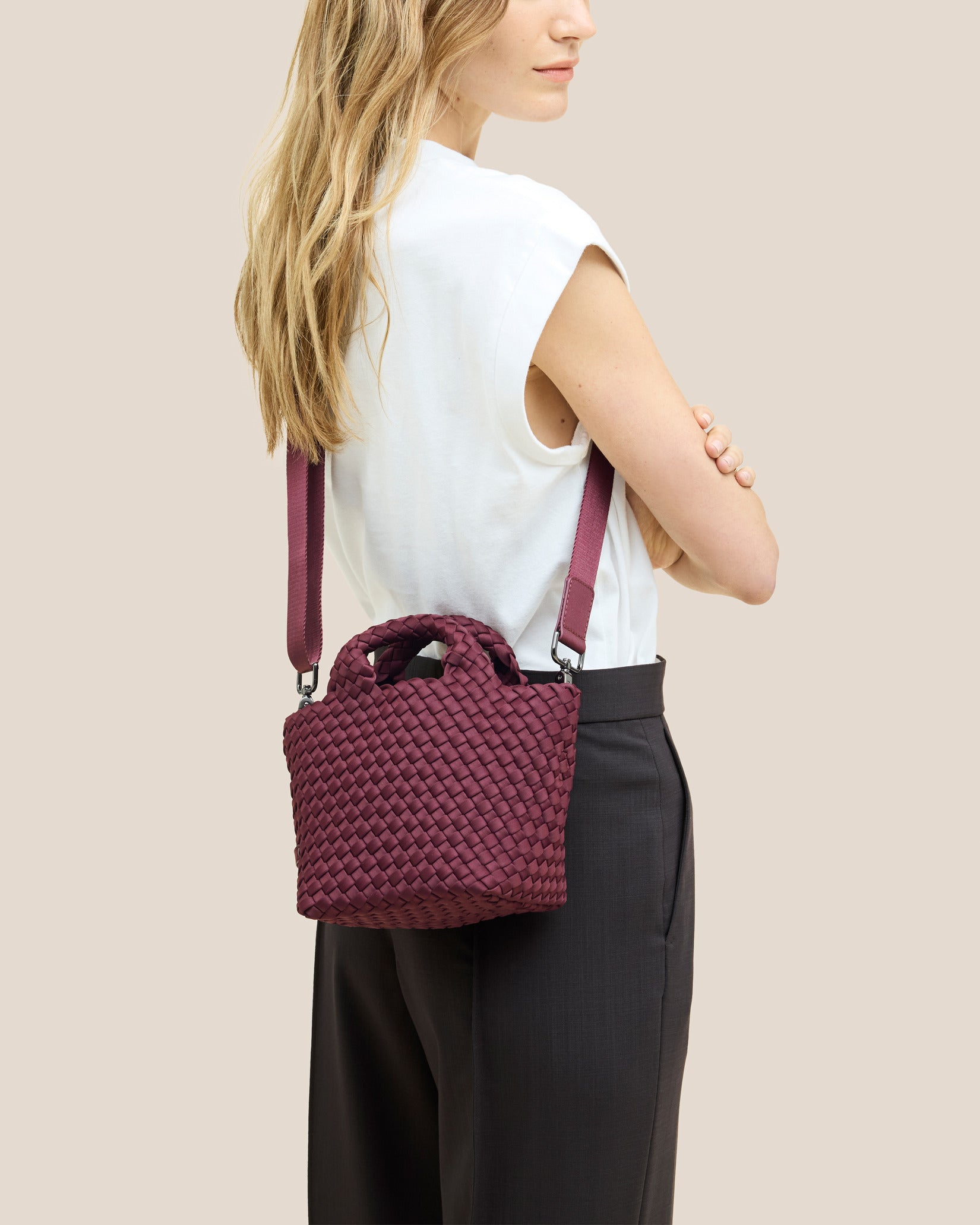 St. Barths Petit Tote Bag in Bordeaux shown on model to illustrate scale and soft silhouette.