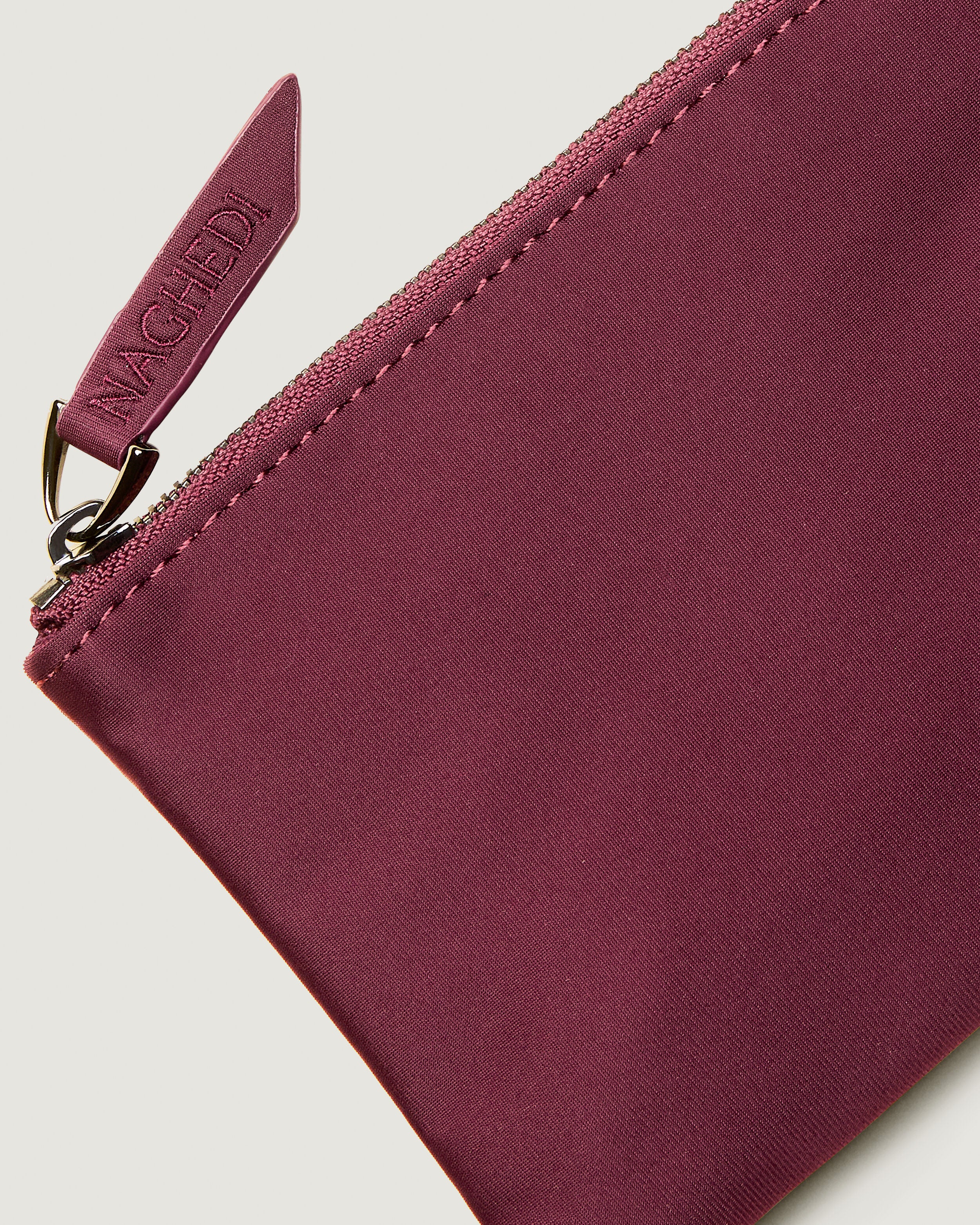 Close-up of included coordinating neoprene zippered pouch.