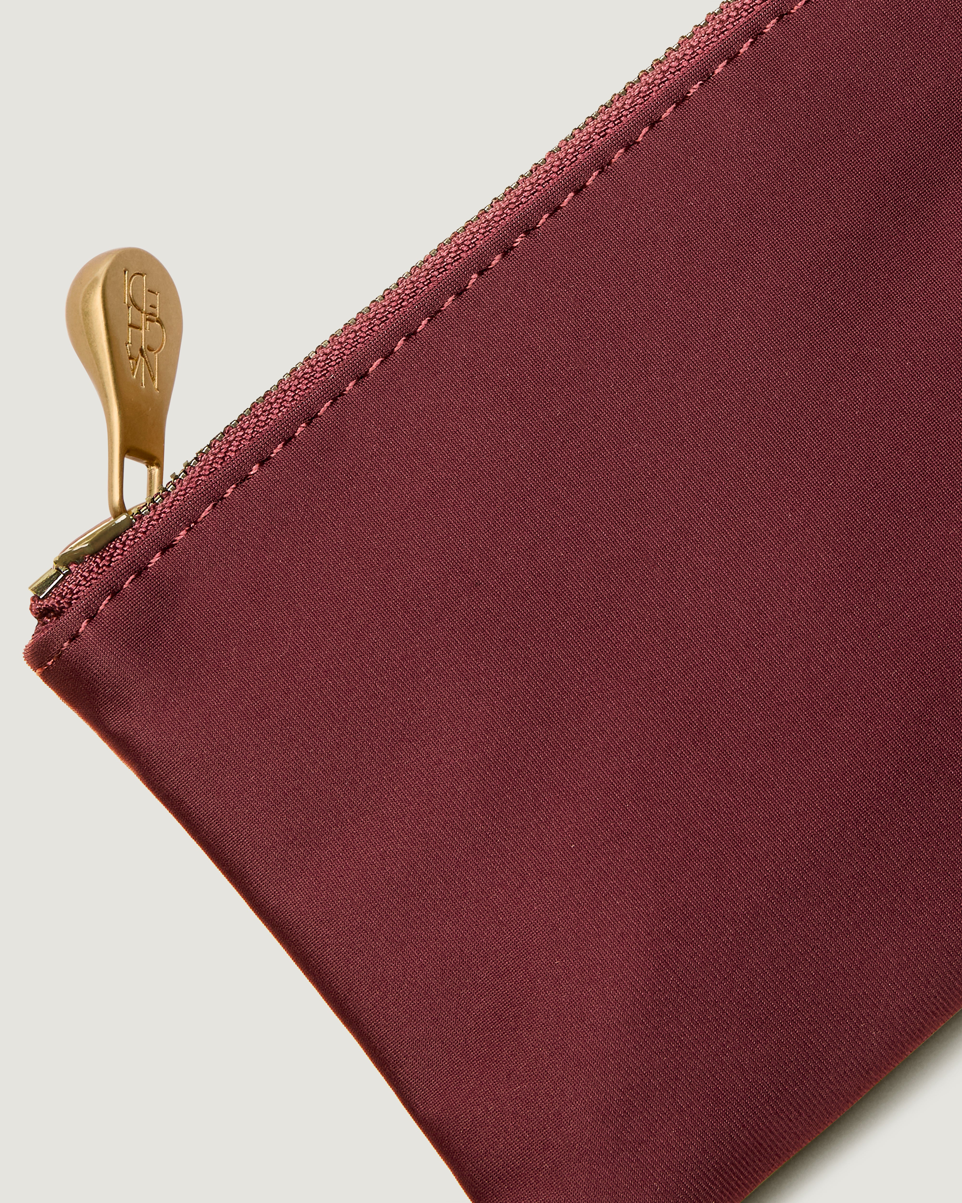 Close-up of included coordinating neoprene zippered pouch.