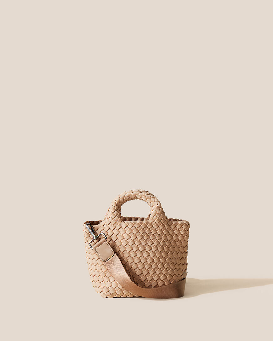 St. Barths Tote in Camel, a camel brown tone, in handwoven neoprene, featuring an open top, woven top handles, and detachable, adjustable nylon crossbody strap.