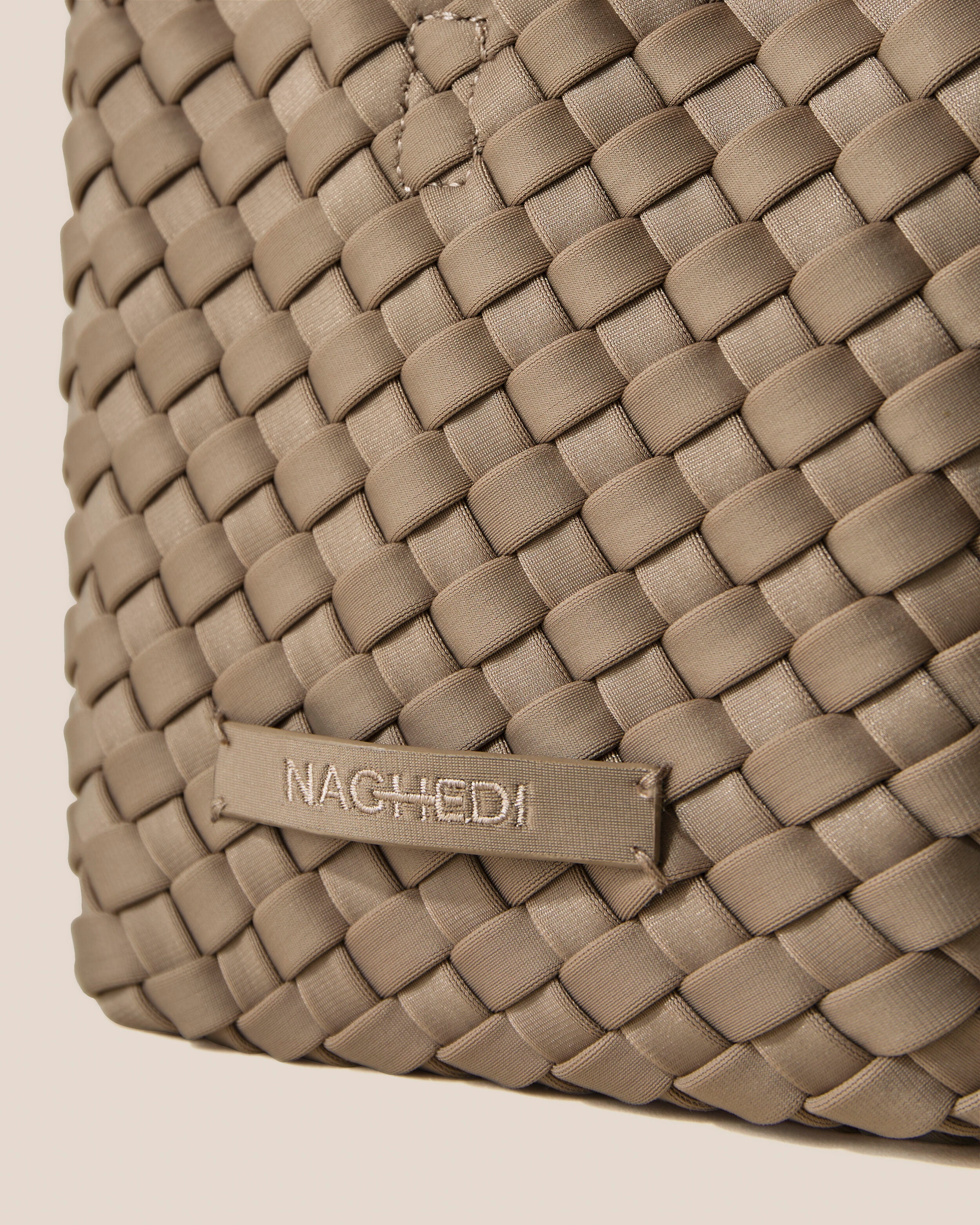 Close-up of stamped NAGHEDI logo on St. Barths Tote in Cashmere.