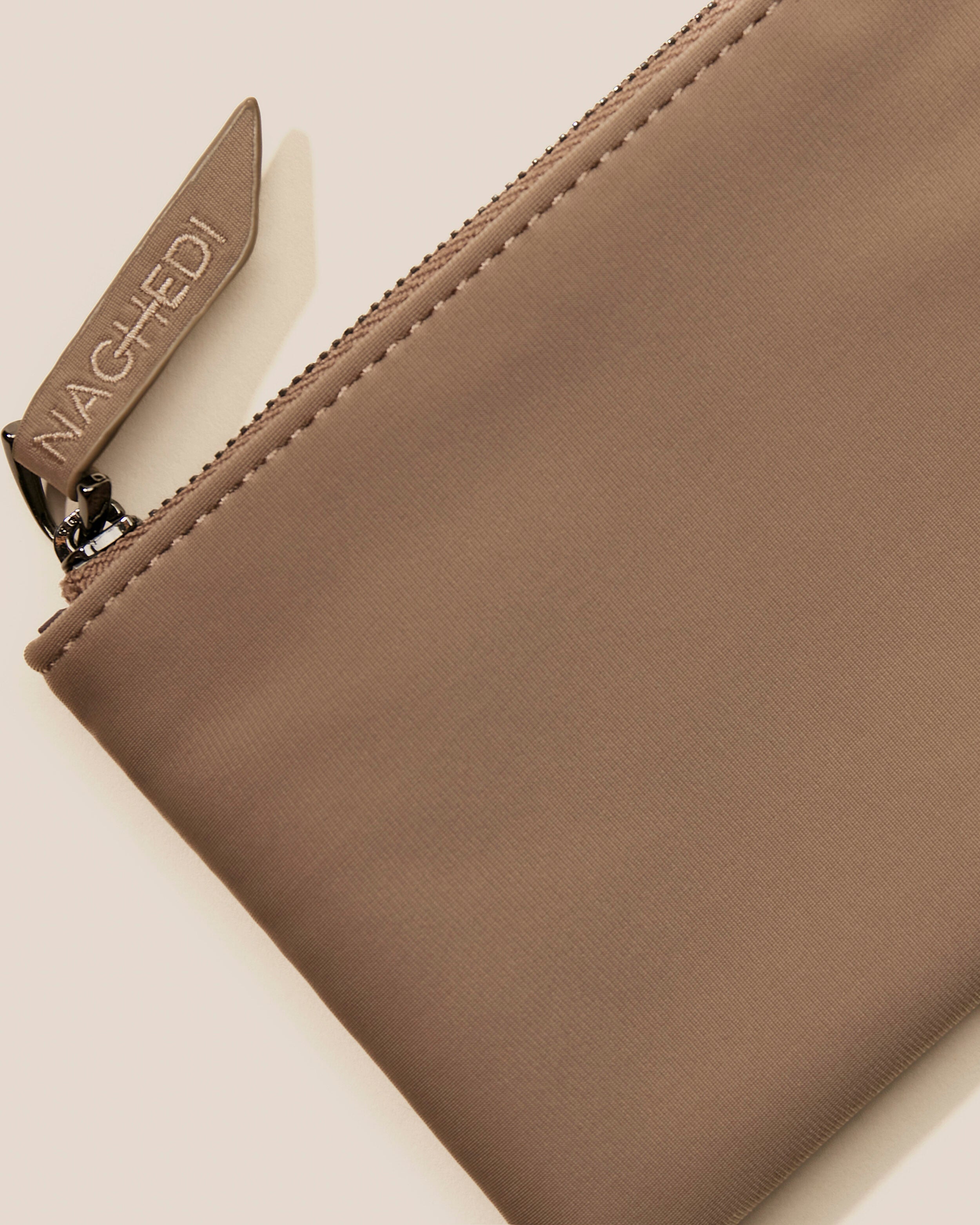 Close-up of included coordinating neoprene zippered pouch.