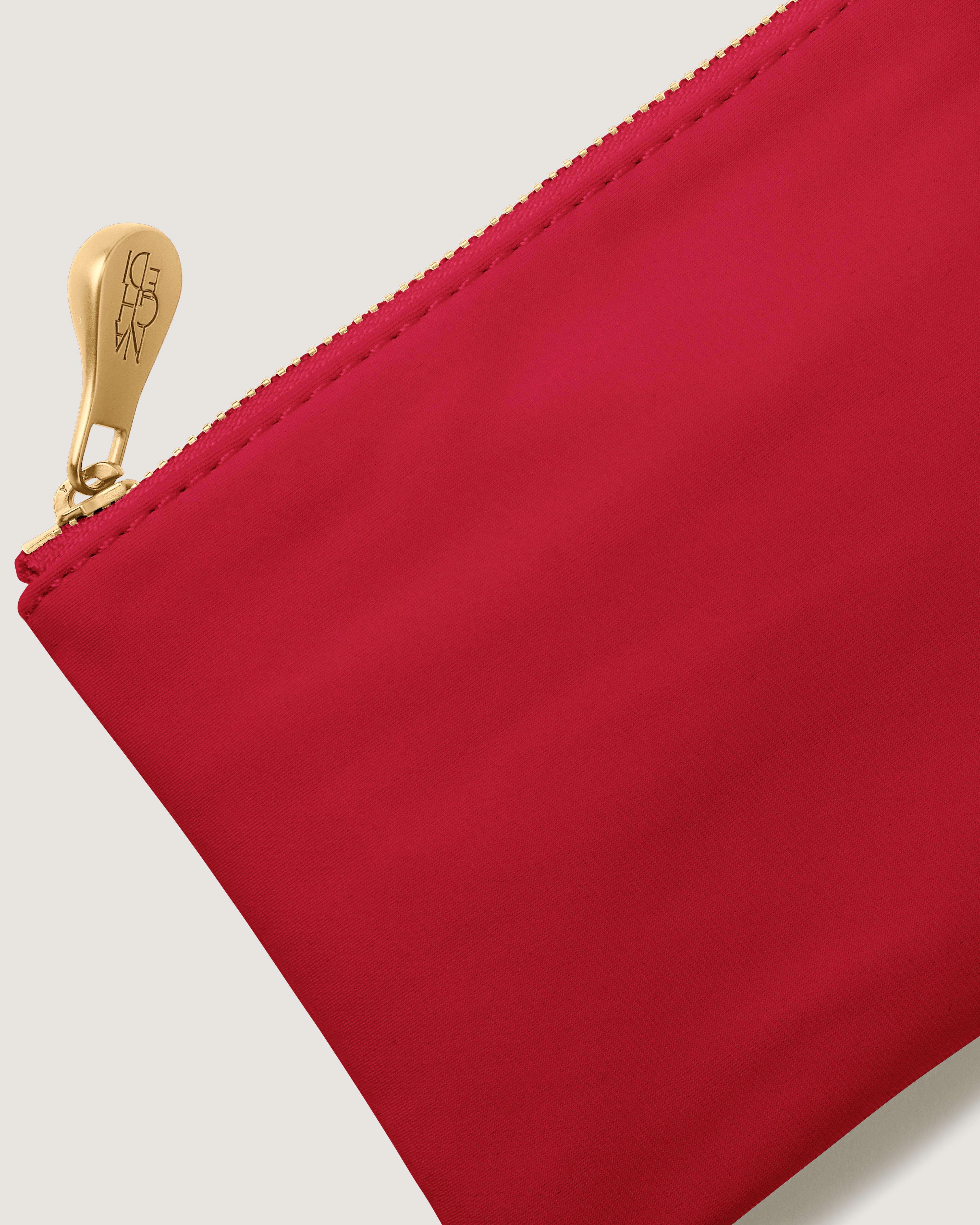 Close up of included neoprene pouch in cherry red