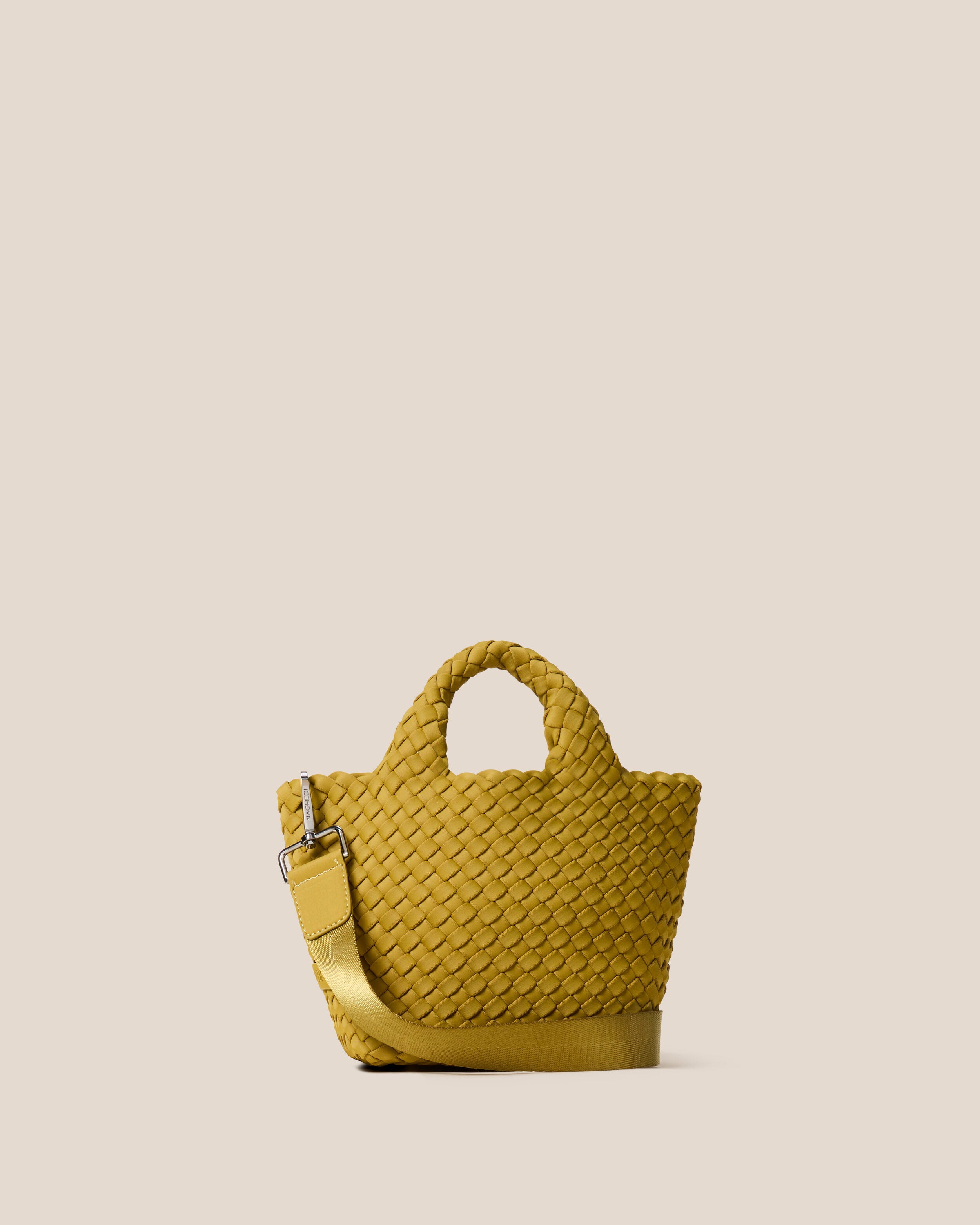 St. Barths Tote in Chartreuse, a yellow-green tone, in handwoven neoprene, featuring an open top, woven top handles, and detachable, adjustable nylon crossbody strap.