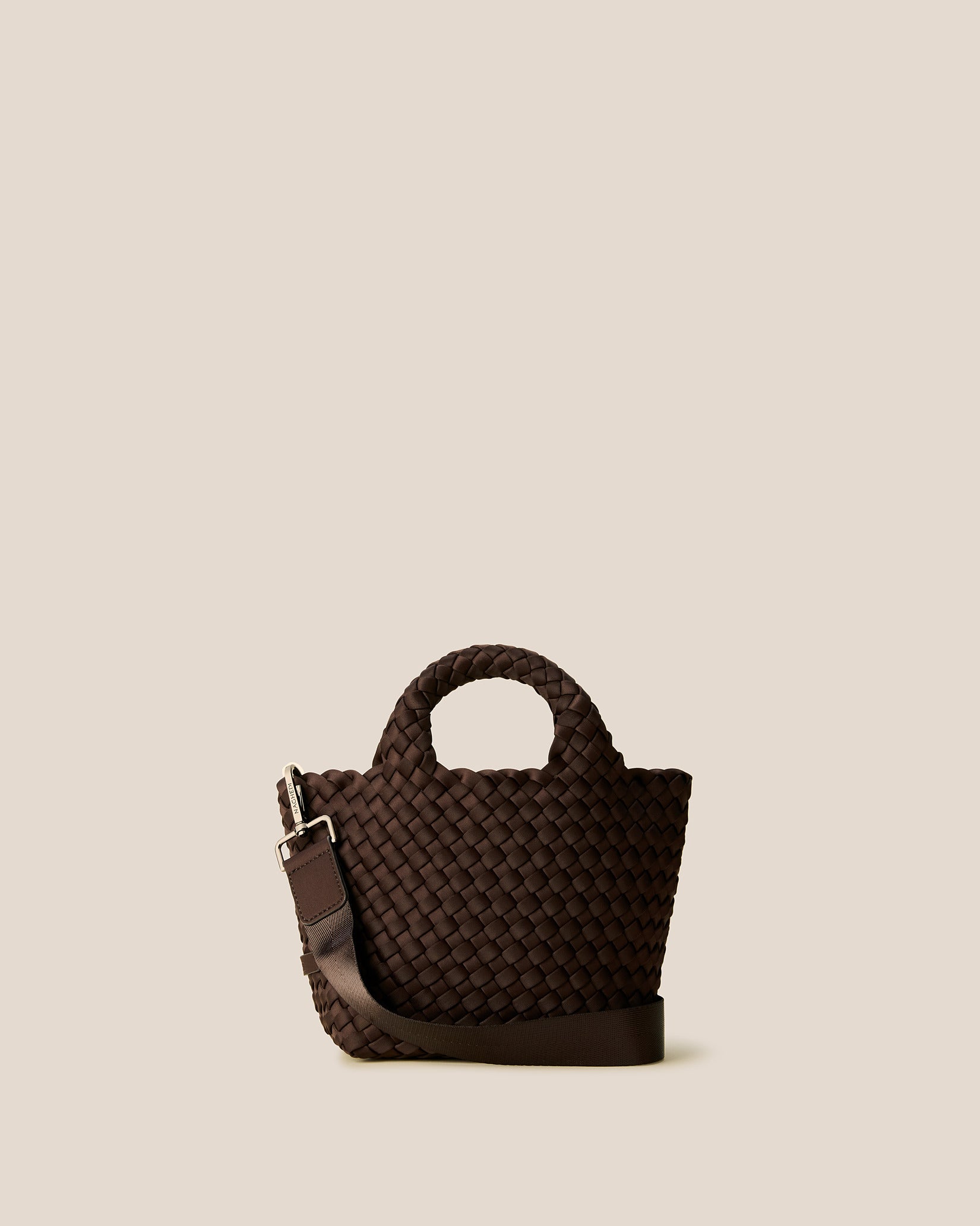 St. Barths Petit Tote Bag in Chocolate, a dark chocolate brown tone, in handwoven neoprene featuring an open top, woven top handles, and detachable, adjustable nylon crossbody strap.