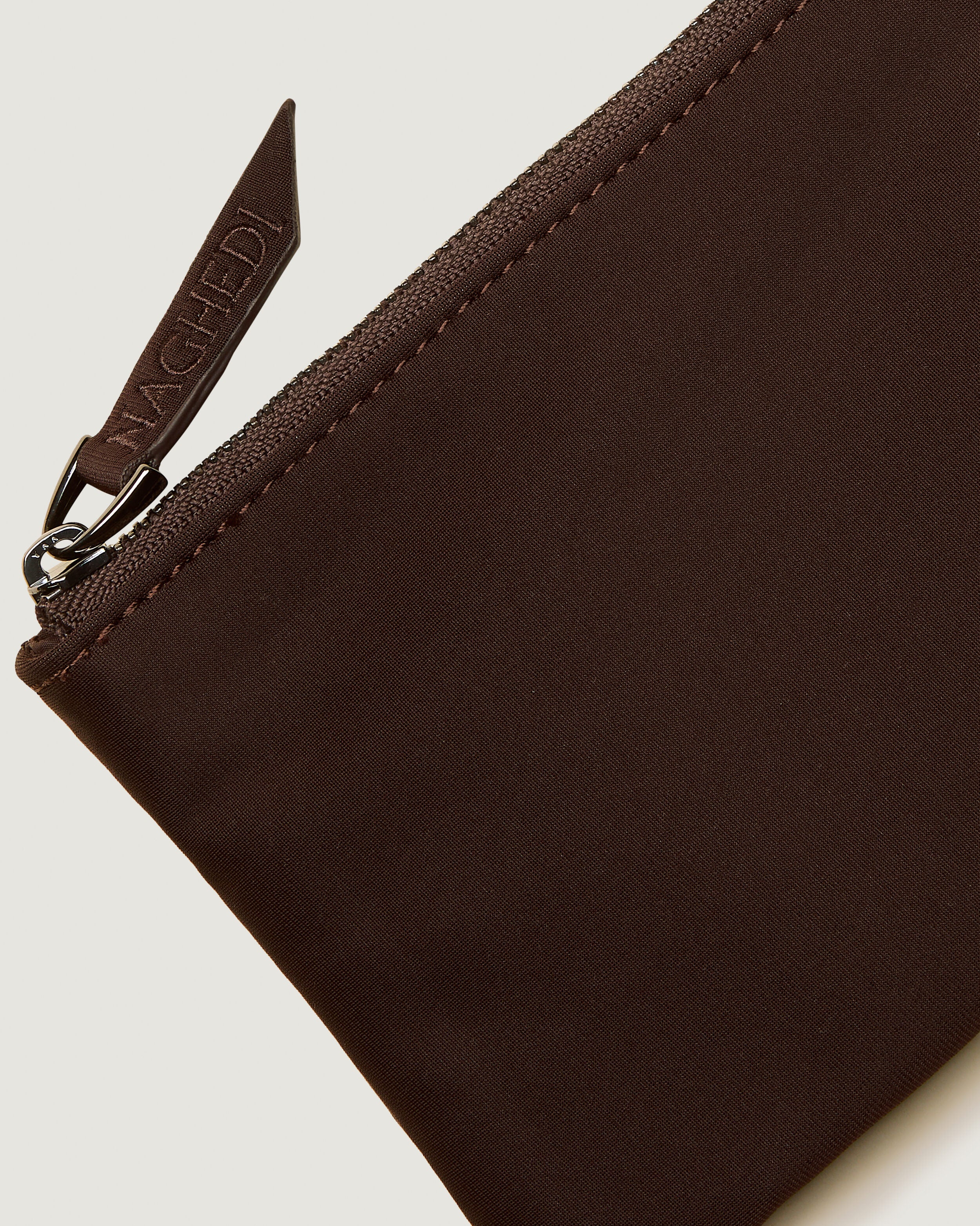 Close-up of included coordinating neoprene zippered pouch.