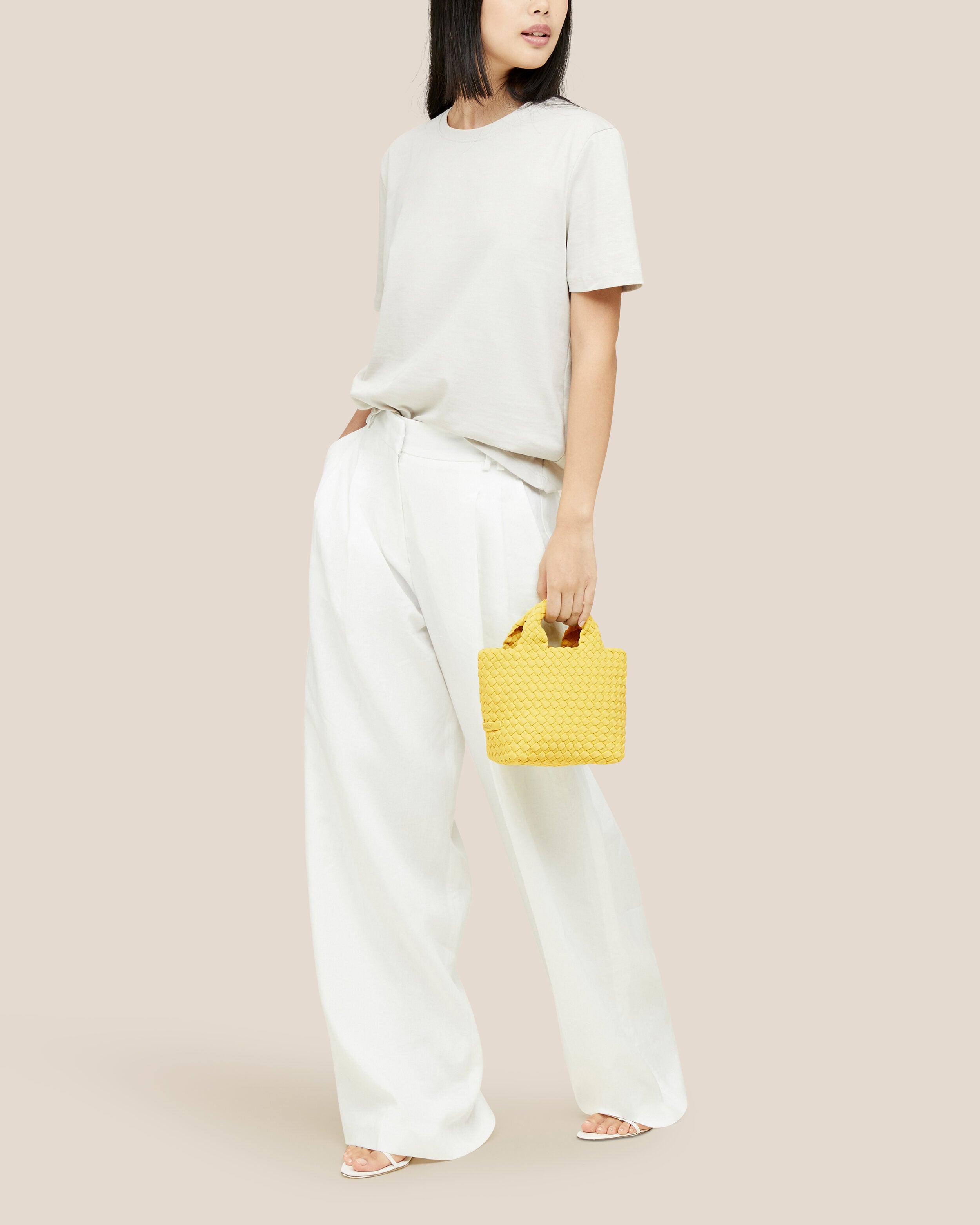 St. Barths Tote in Citron shown on model to illustrate scale and soft silhouette.