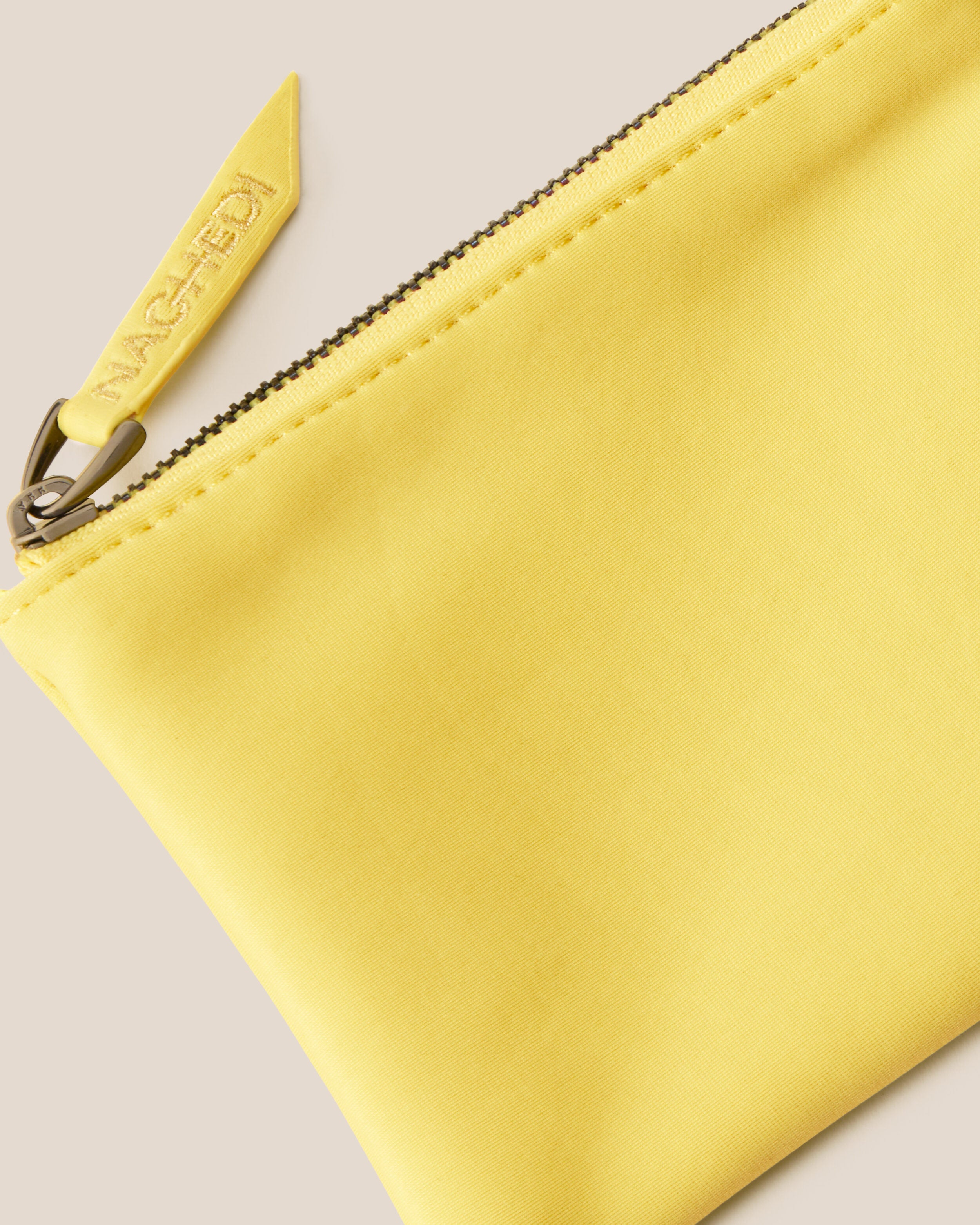 Close-up of included coordinating neoprene zippered pouch.
