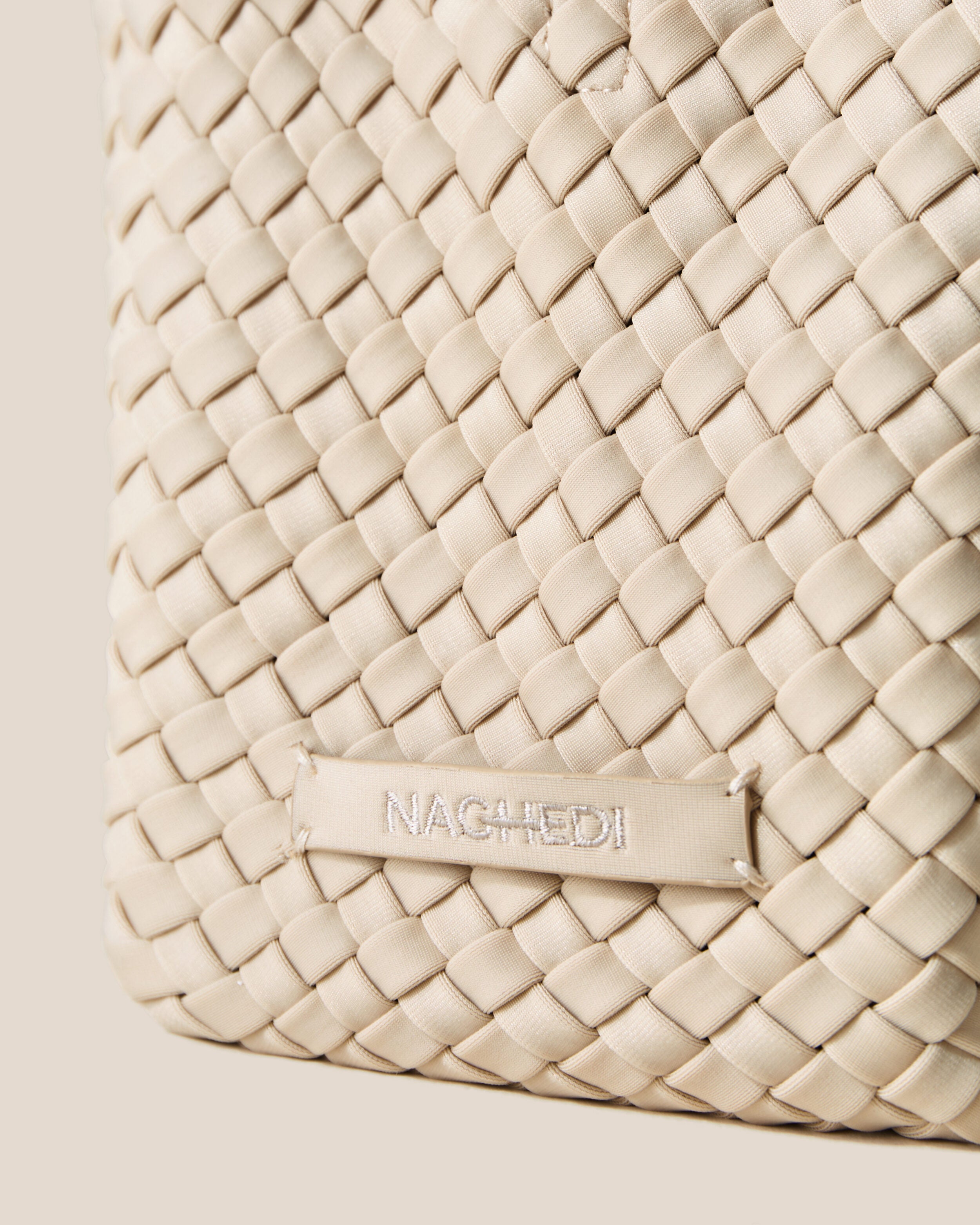 Close-up of stamped NAGHEDI logo on St. Barths Tote in Ecru.