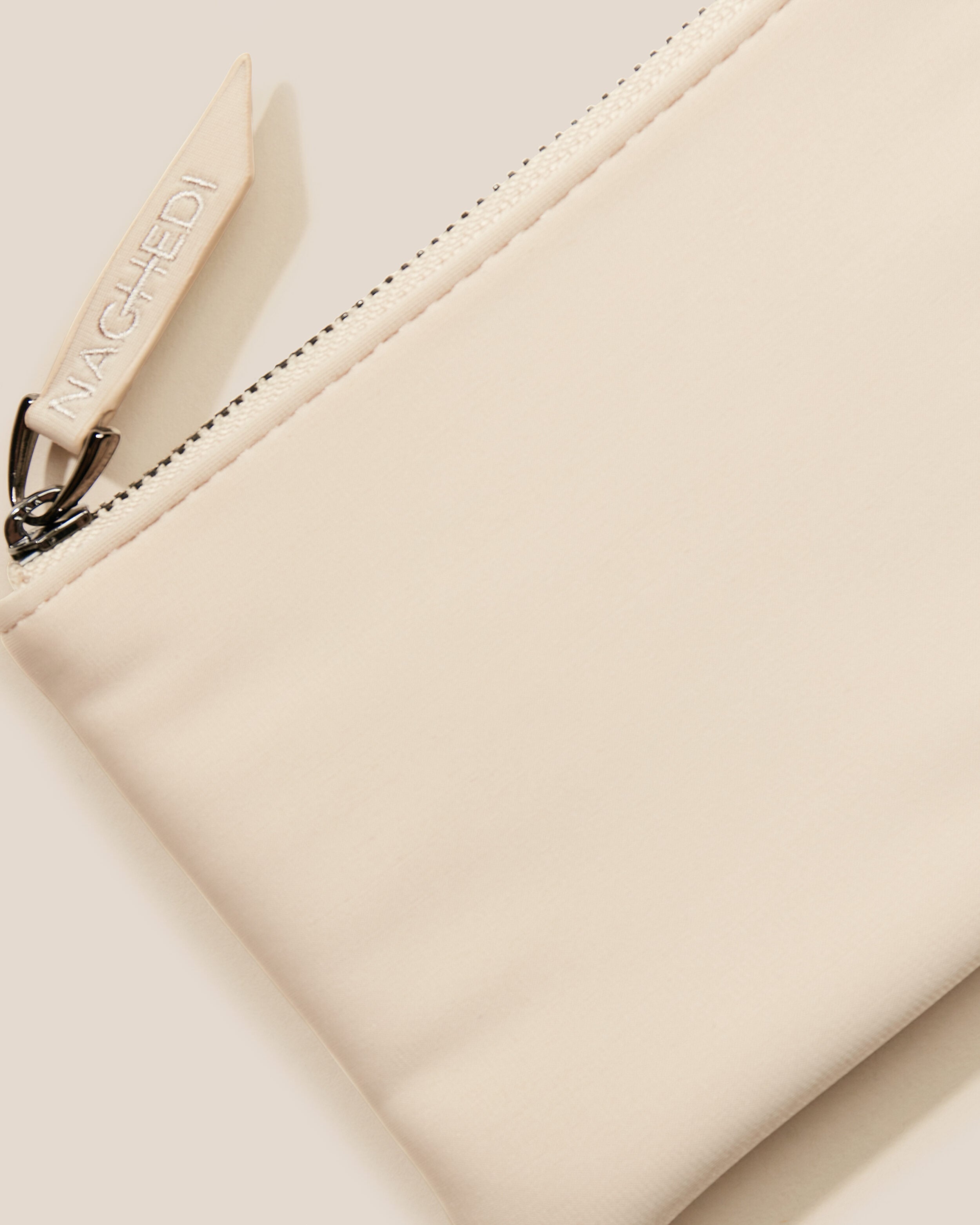 Close-up of included coordinating neoprene zippered pouch.