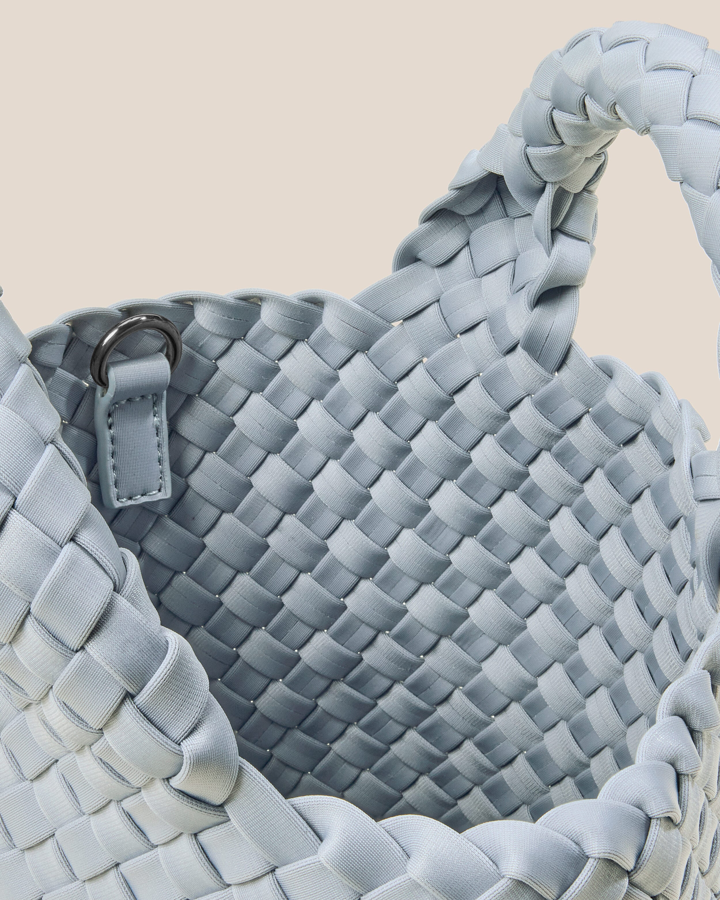 Interior close-up of St. Barths Tote in Glacier showing its open top, and unlined interior.