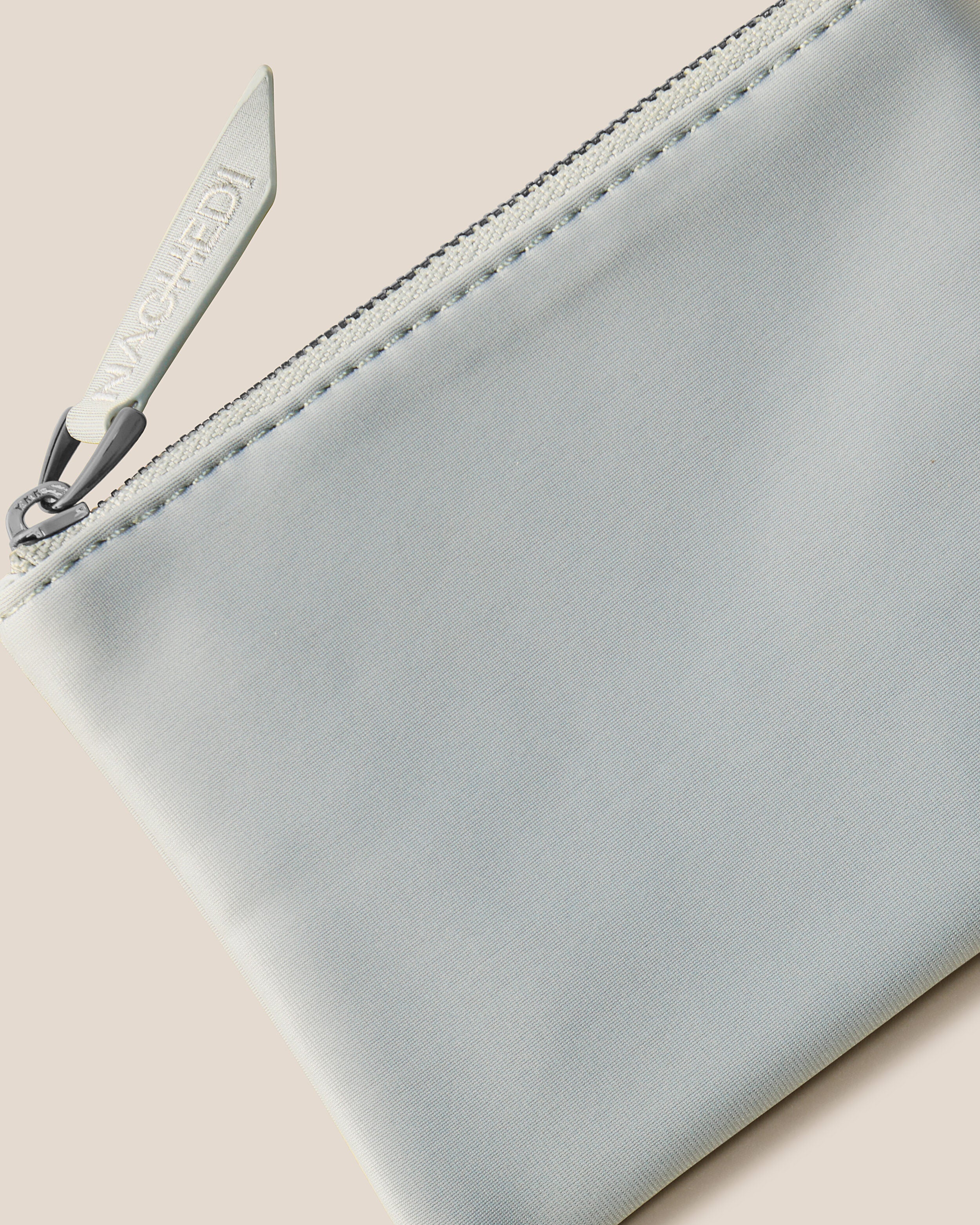 Close-up of included coordinating neoprene zippered pouch.