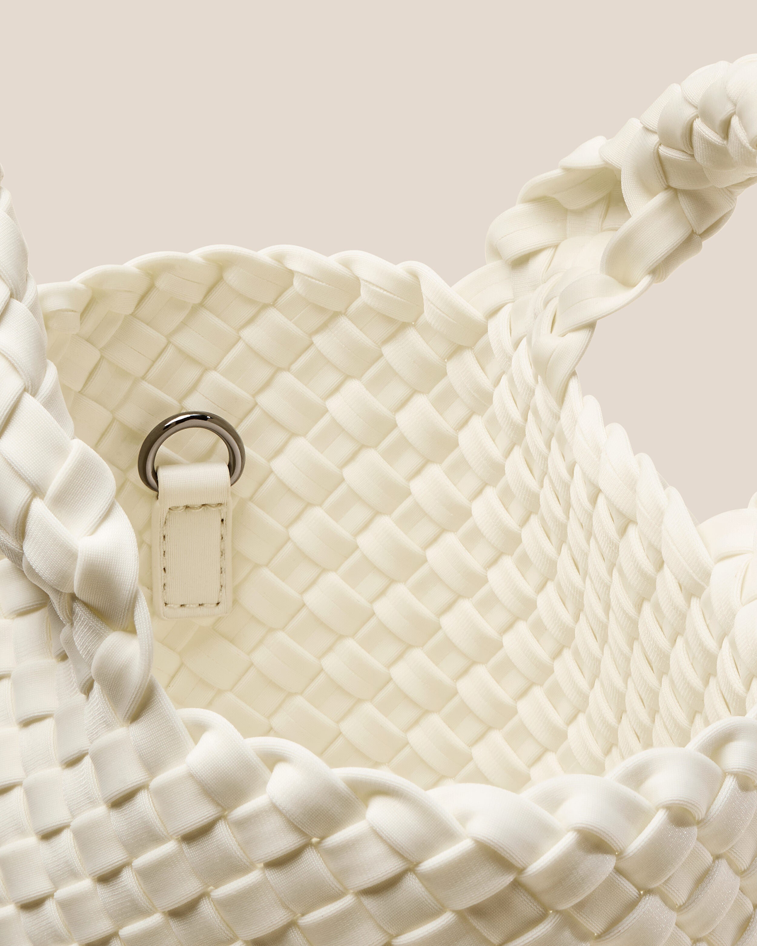 Interior close-up of St. Barths Tote in Jasmine showing its open top, and unlined interior.