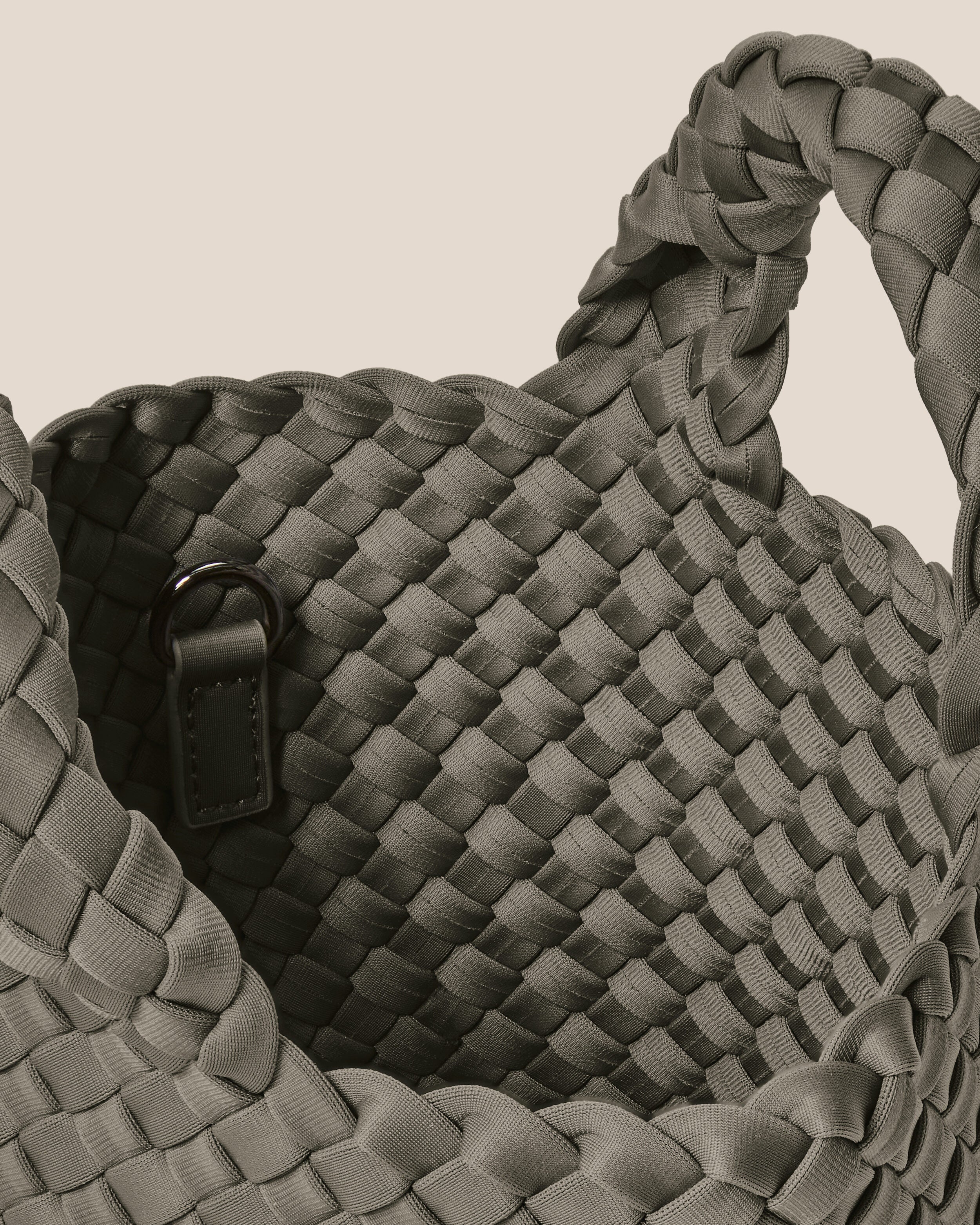 Interior close-up of St. Barths Tote in Laurel showing its open top, and unlined interior.