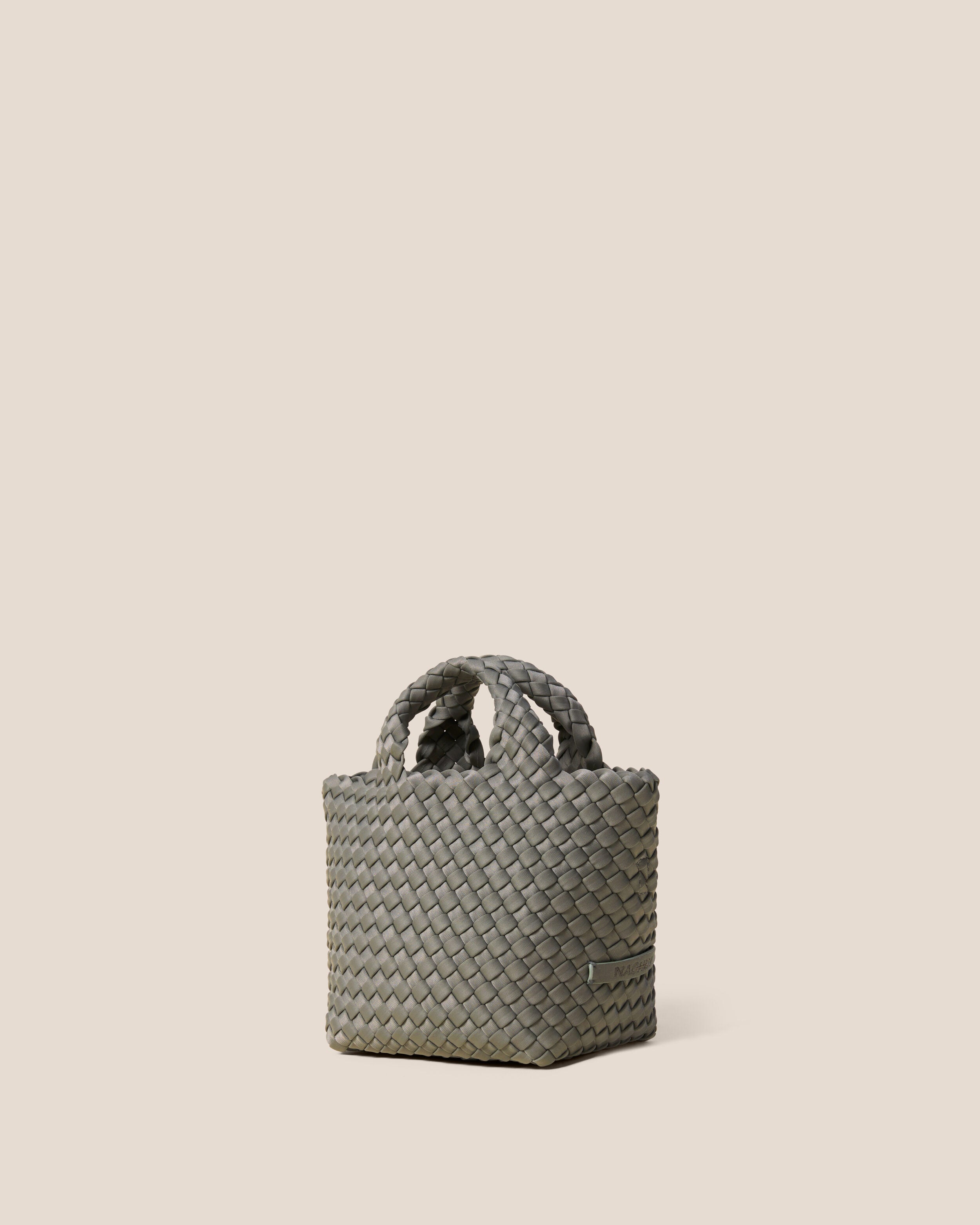 St. Barths Tote in Laurel shown from a side angle, highlighting its handwoven neoprene construction and open top.