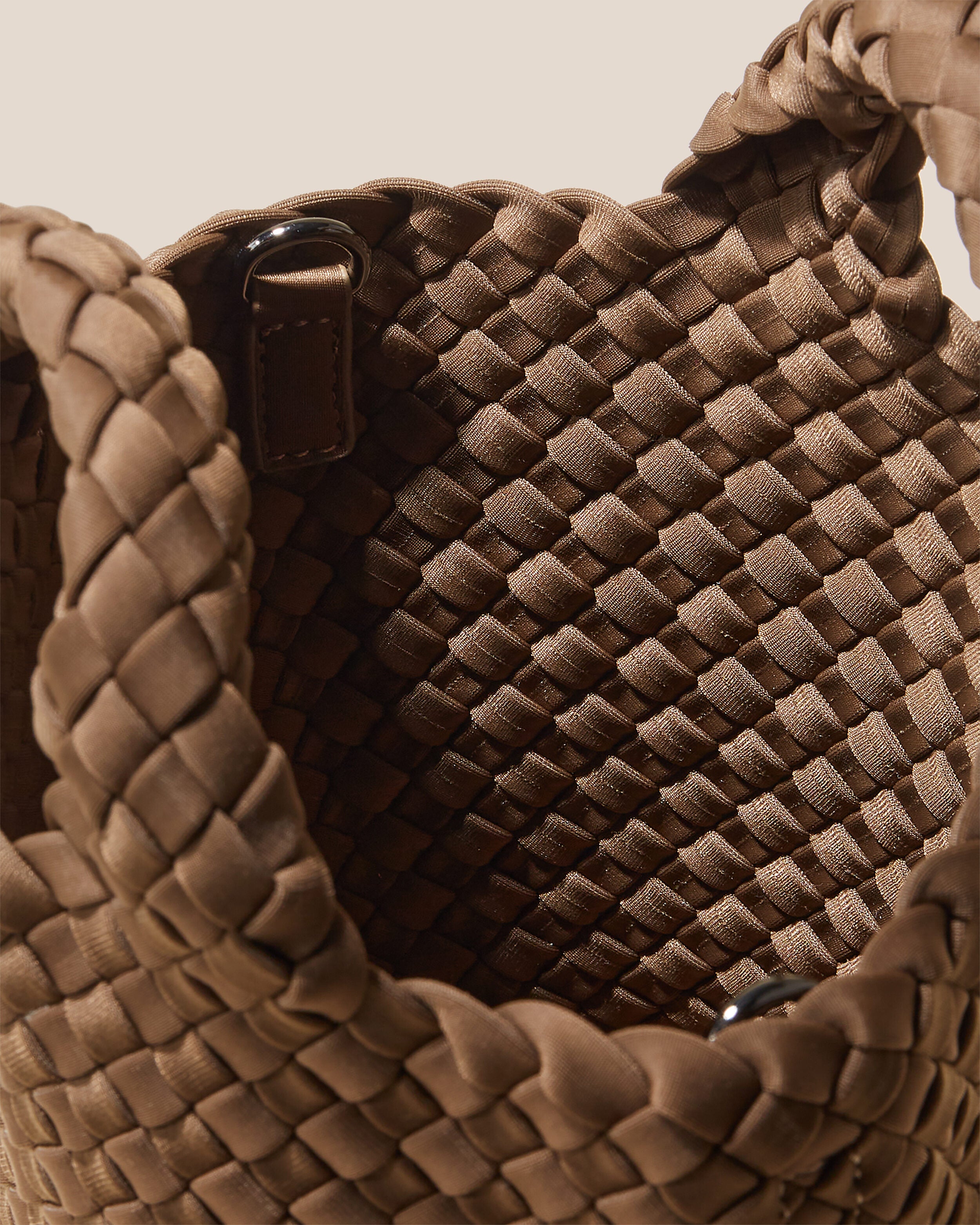 Interior close-up of St. Barths Tote in Mink showing its open top, and unlined interior.