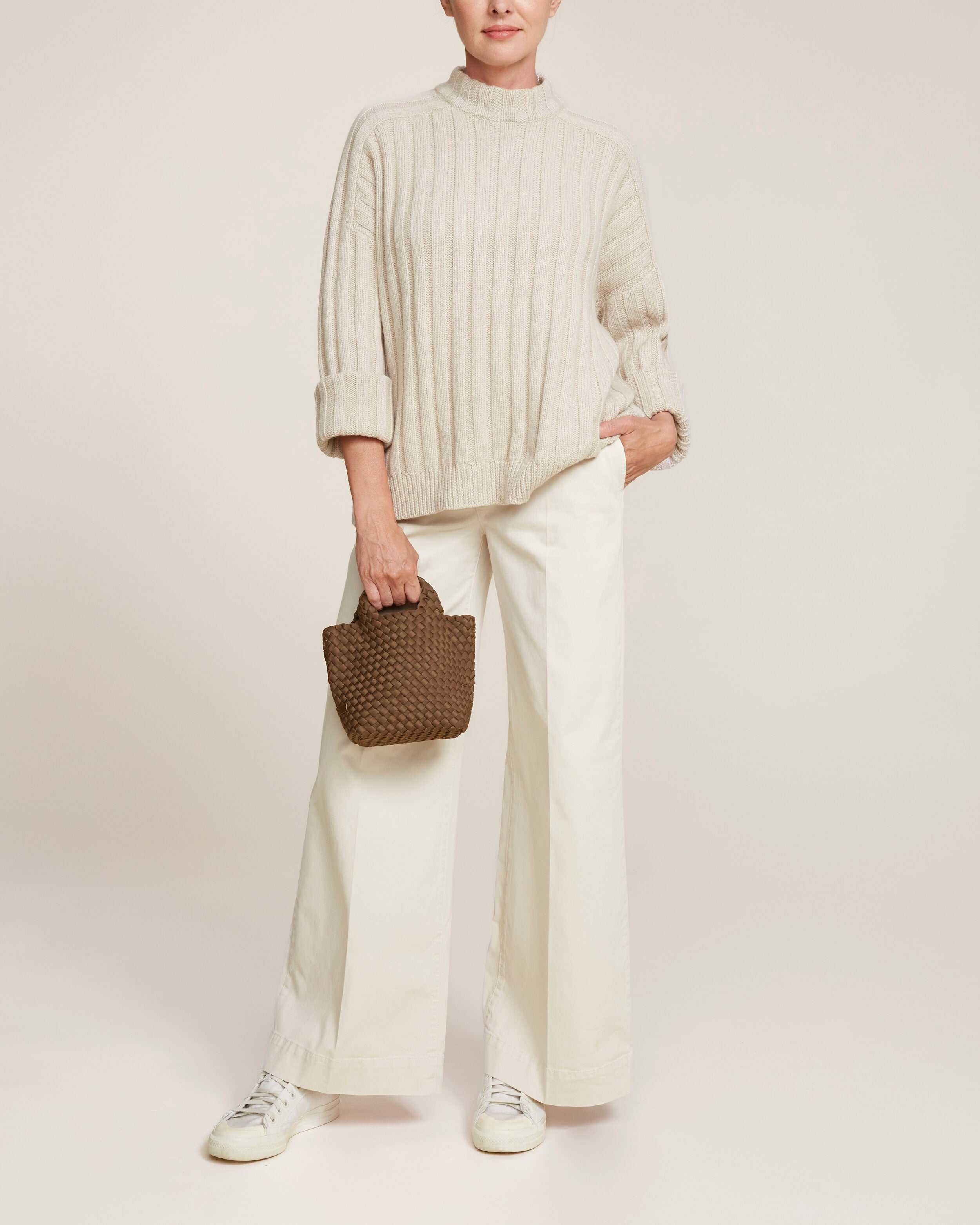 St. Barths Tote in Mink shown on model to illustrate scale and soft silhouette.