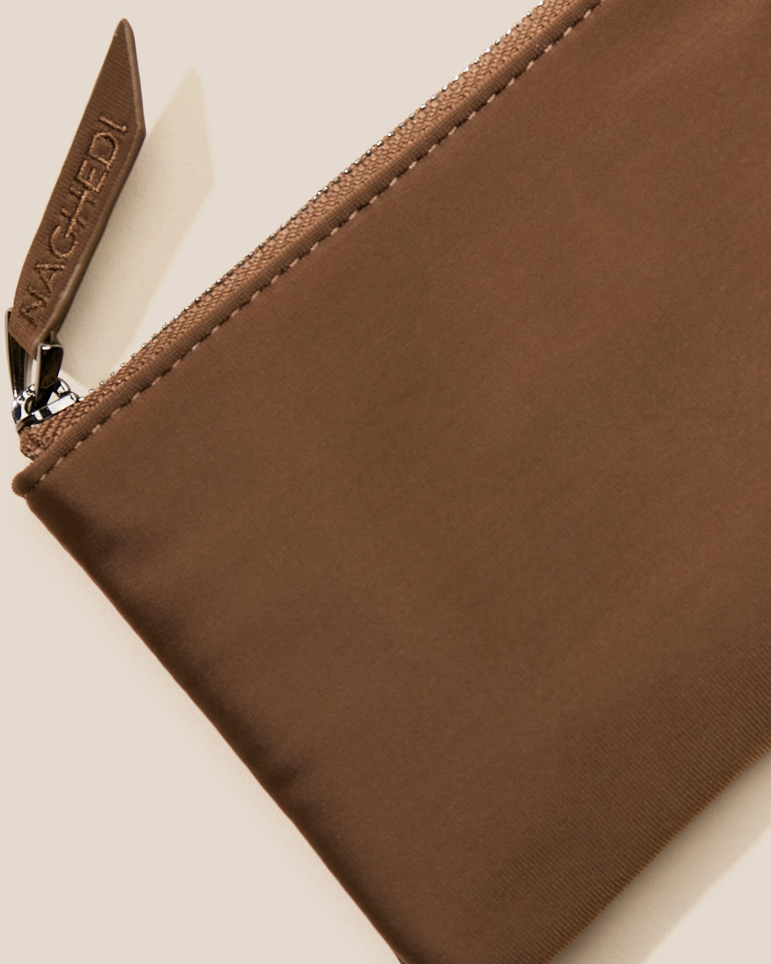 Close-up of included coordinating neoprene zippered pouch.