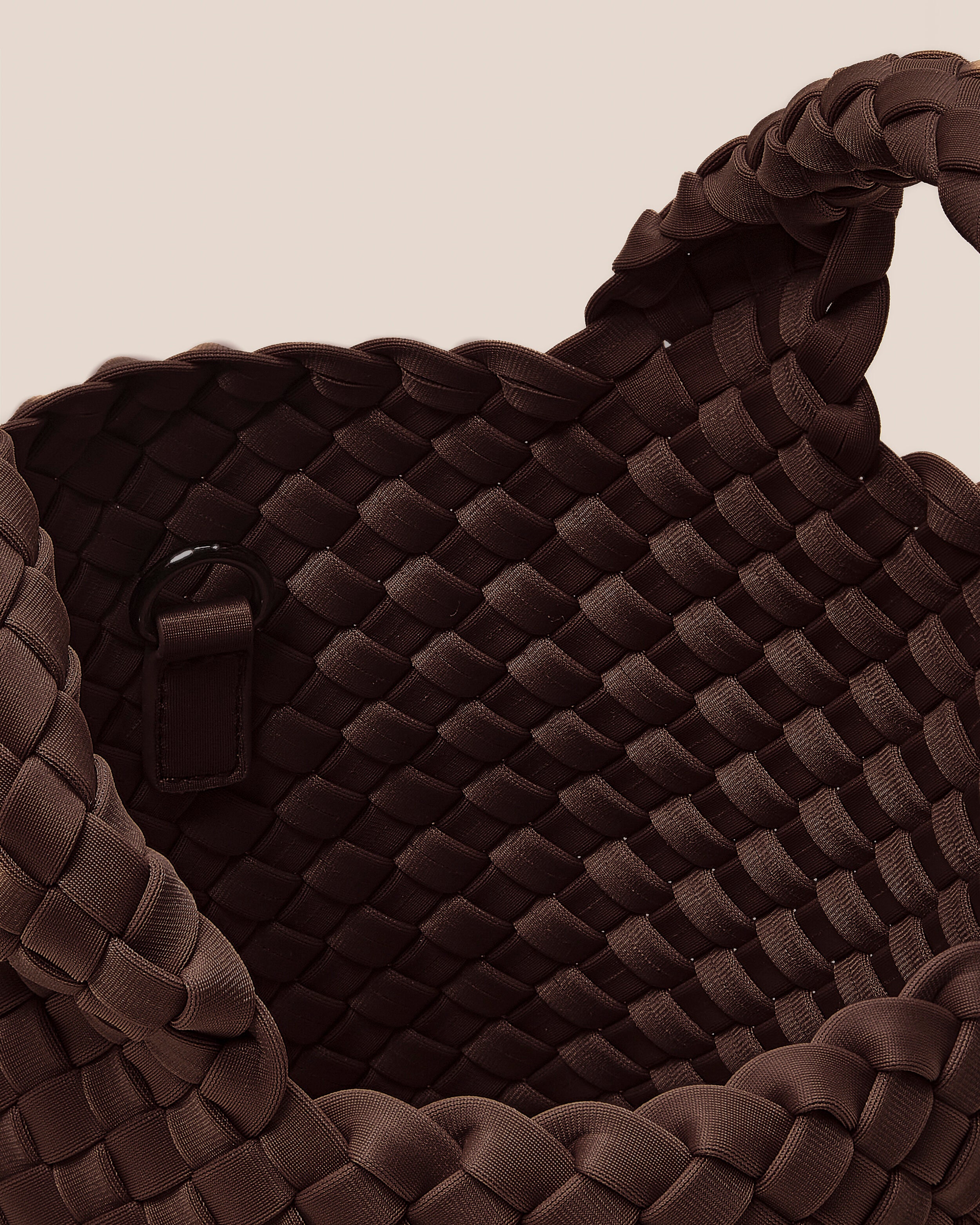 Interior close-up of St. Barths Tote in Mocha showing its open top, and unlined interior.