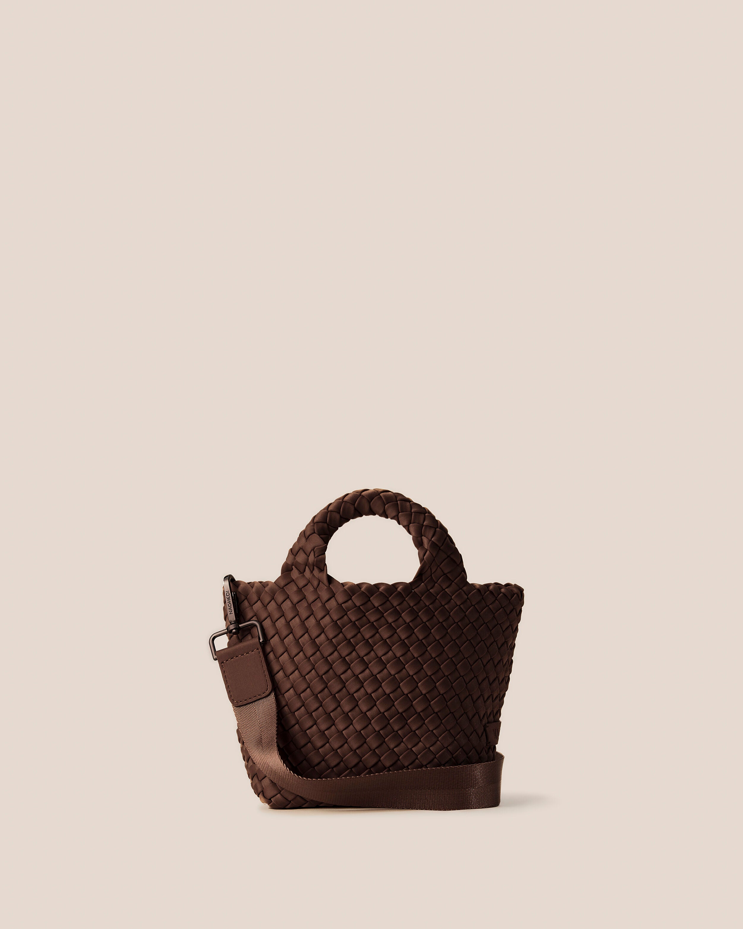 St. Barths Tote in Mocha in handwoven neoprene, featuring an open top, woven top handles, and detachable, adjustable nylon crossbody strap.