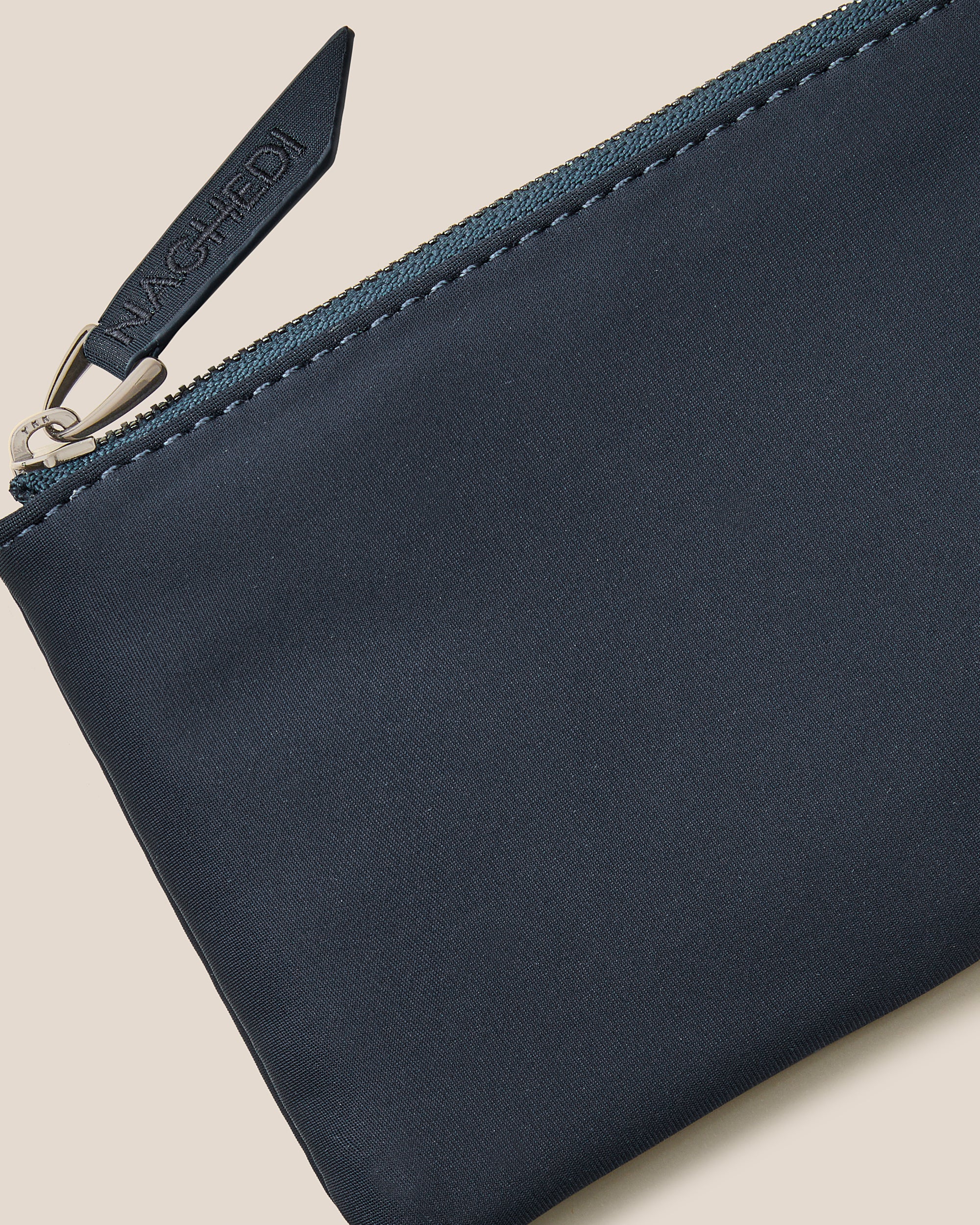 Close-up of included coordinating neoprene zippered pouch.