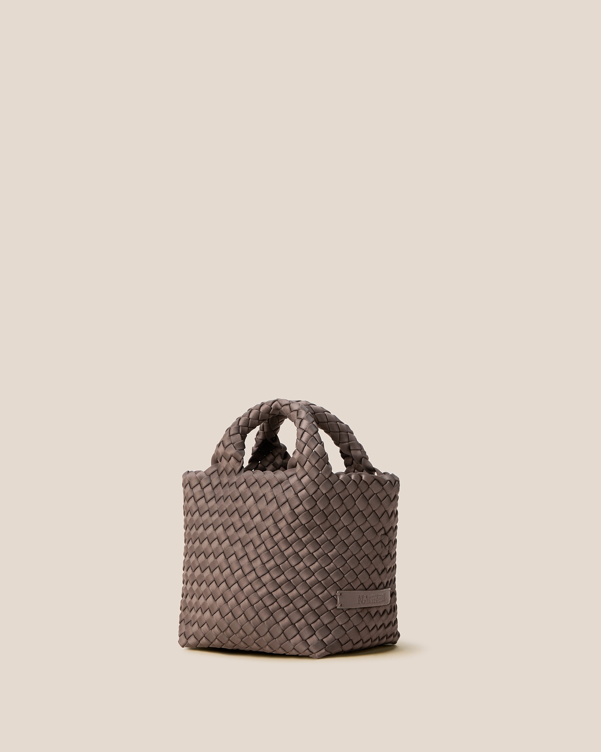 St. Barths Tote in Napa shown from a side angle, highlighting its handwoven neoprene construction and open top.