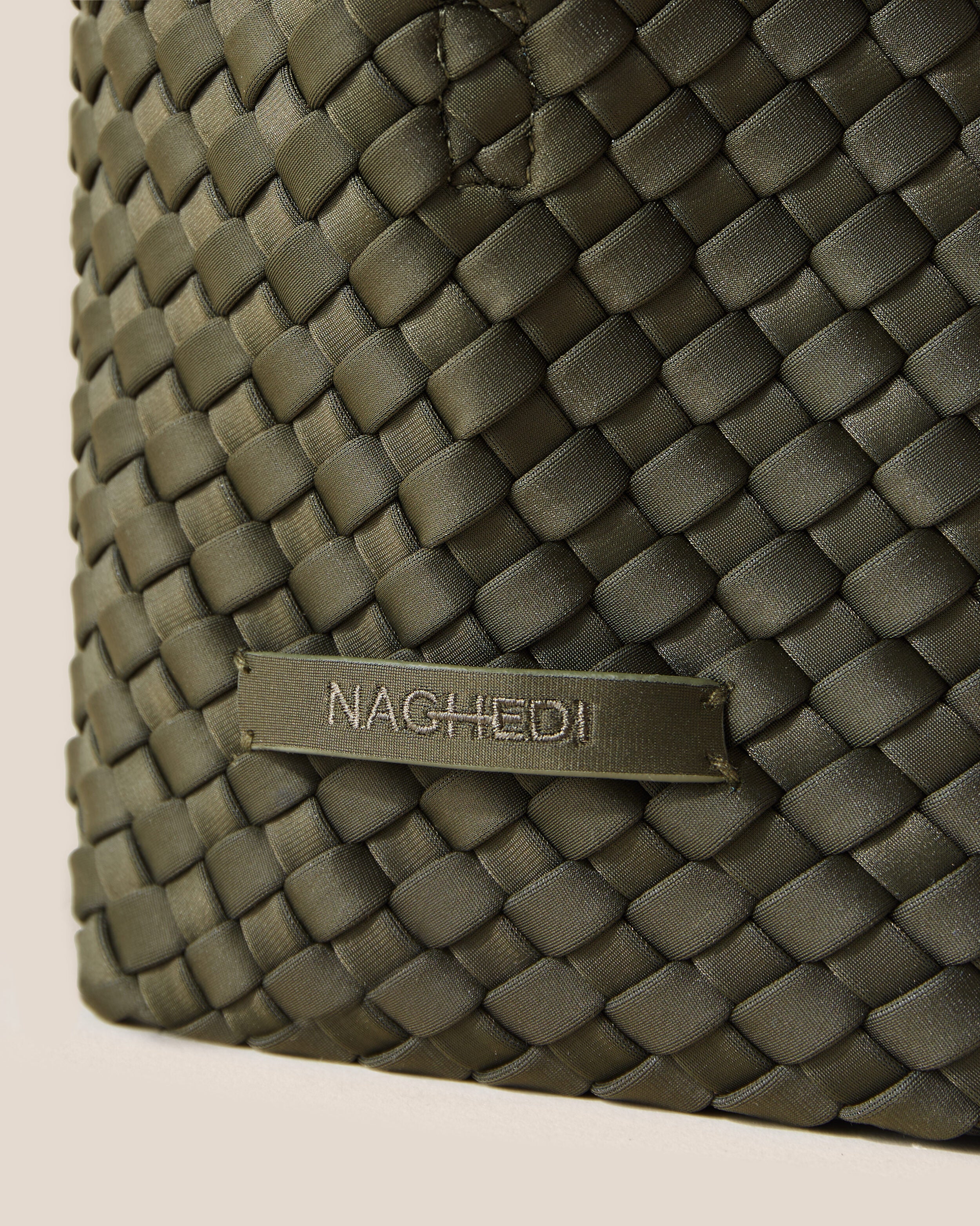 Close-up of stamped NAGHEDI logo on St. Barths Tote in Olive.