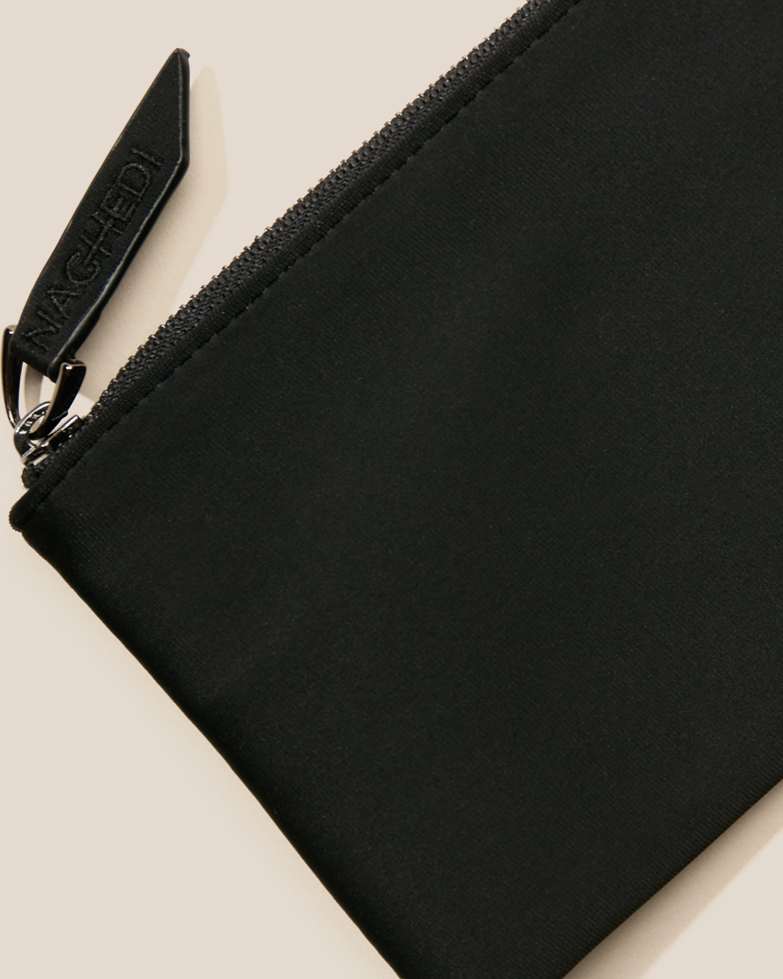 Close-up of included coordinating neoprene zippered pouch.