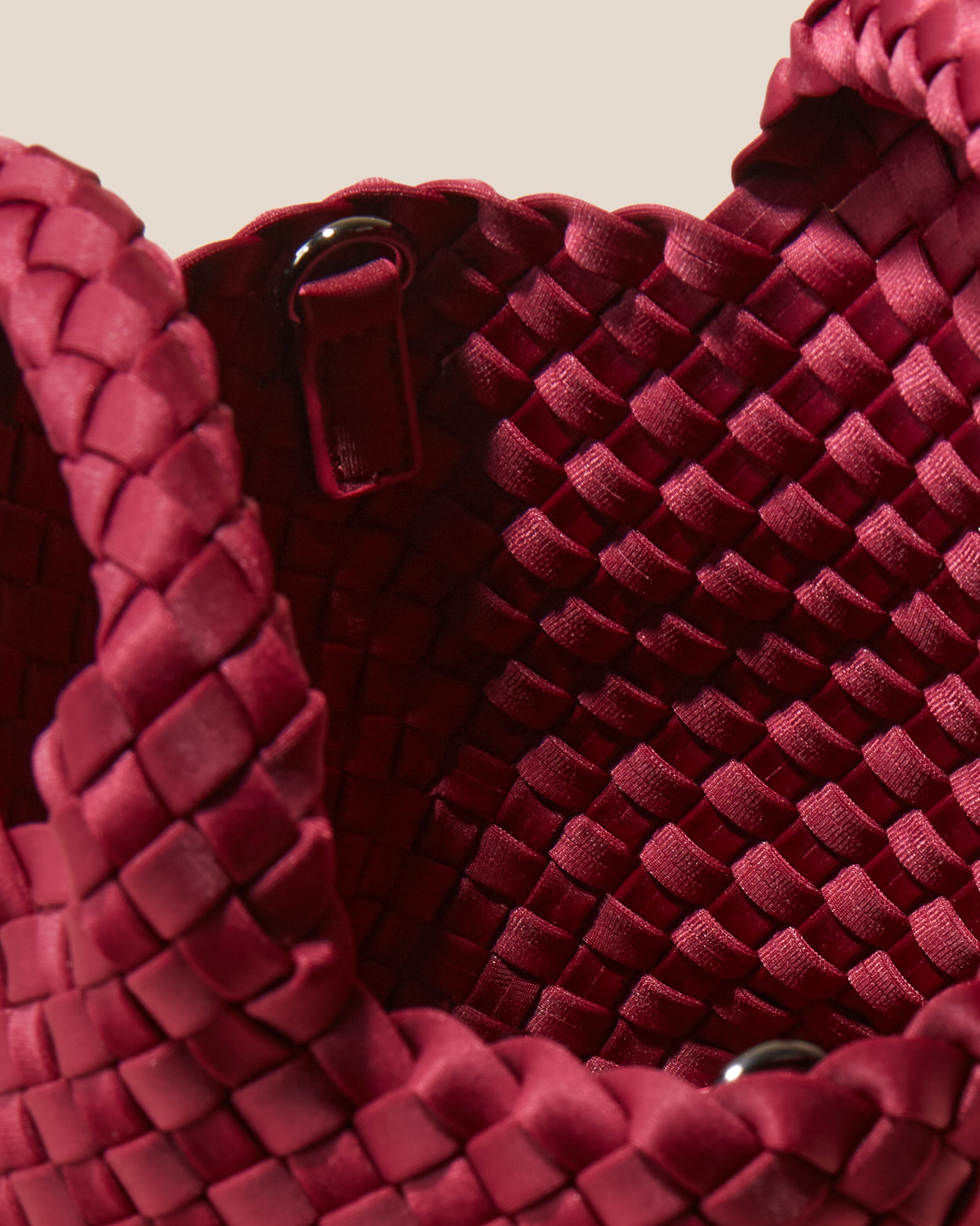 Interior close-up of St. Barths Tote in Rosewood showing its open top, and unlined interior.