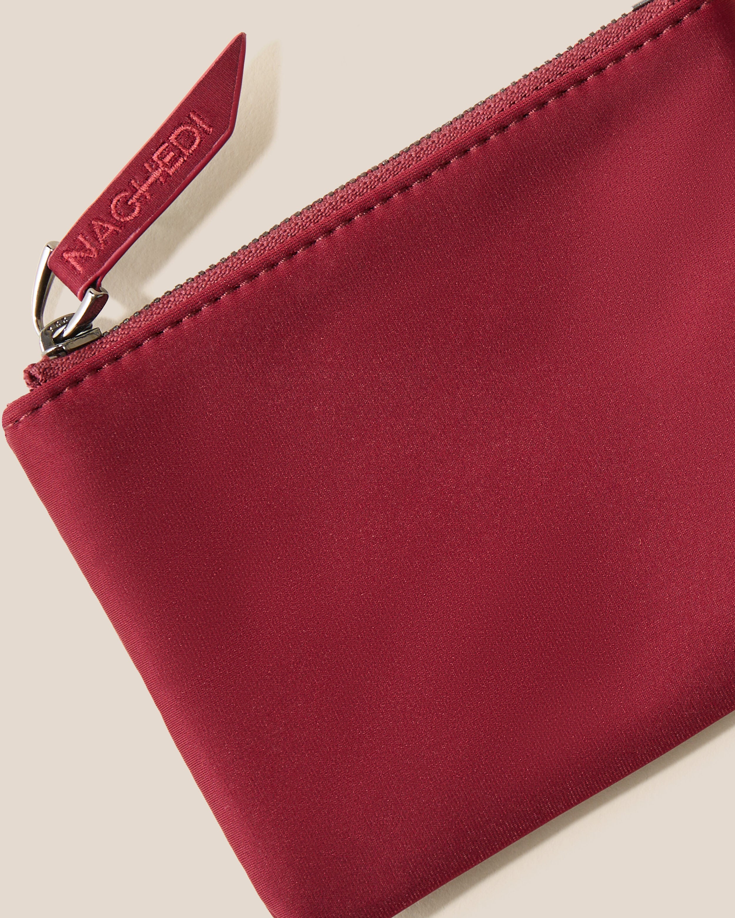 Close-up of included coordinating neoprene zippered pouch.