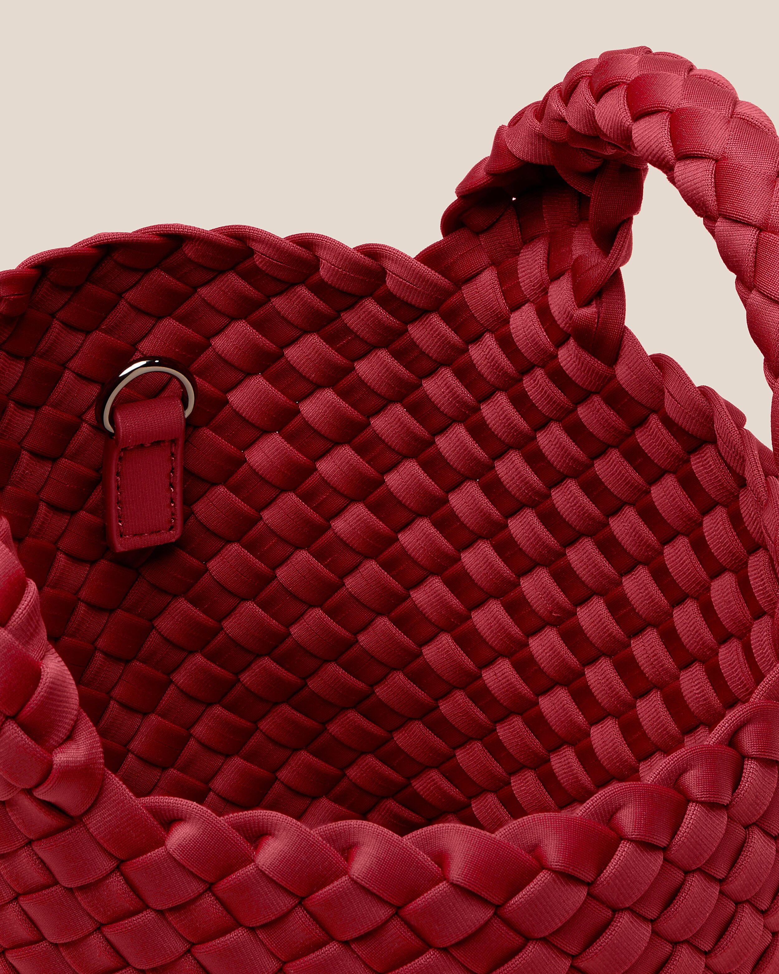 Interior close-up of St. Barths Tote in Rosso showing its open top, and unlined interior.