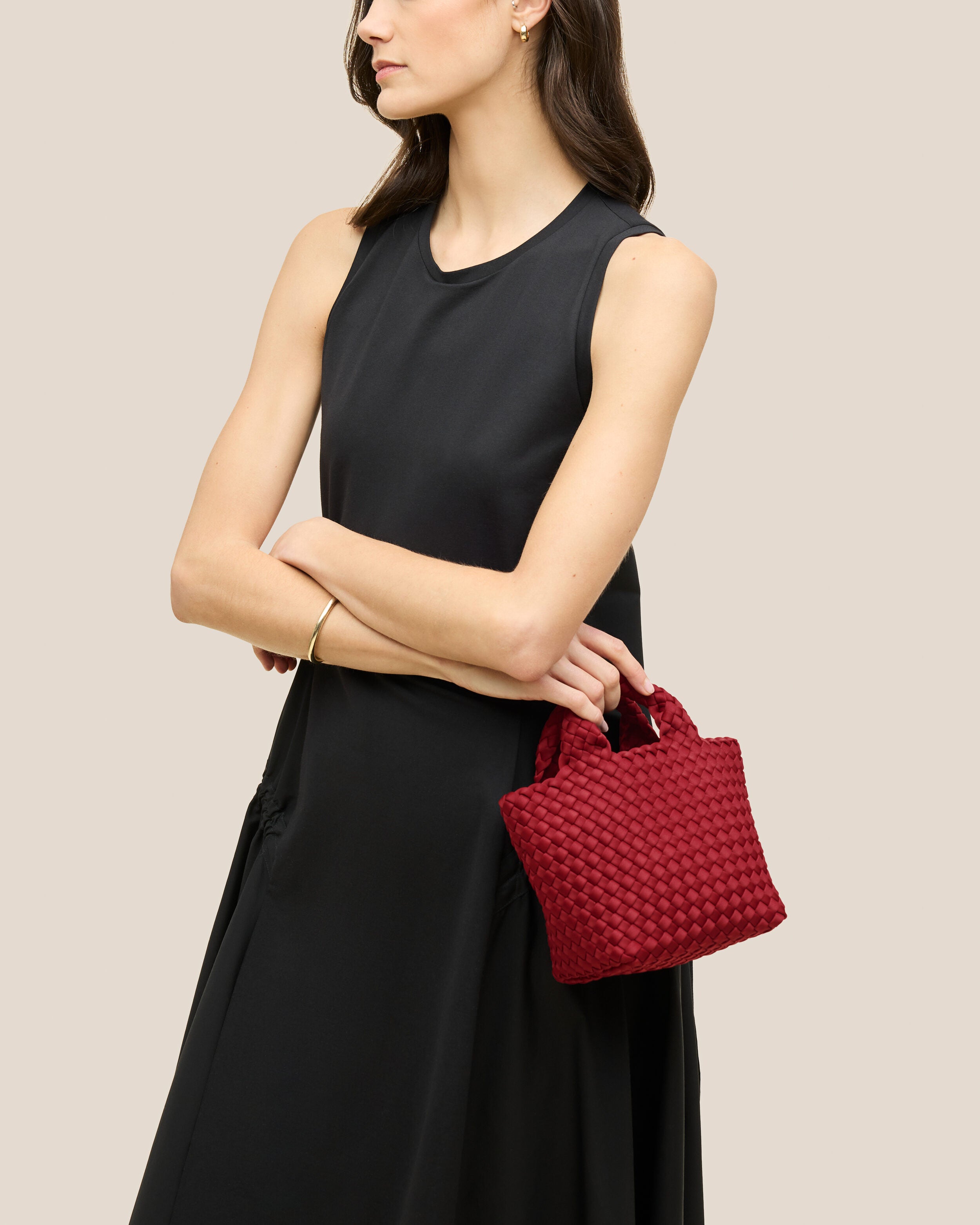 St. Barths Tote in Rosso shown on model to illustrate scale and soft silhouette.