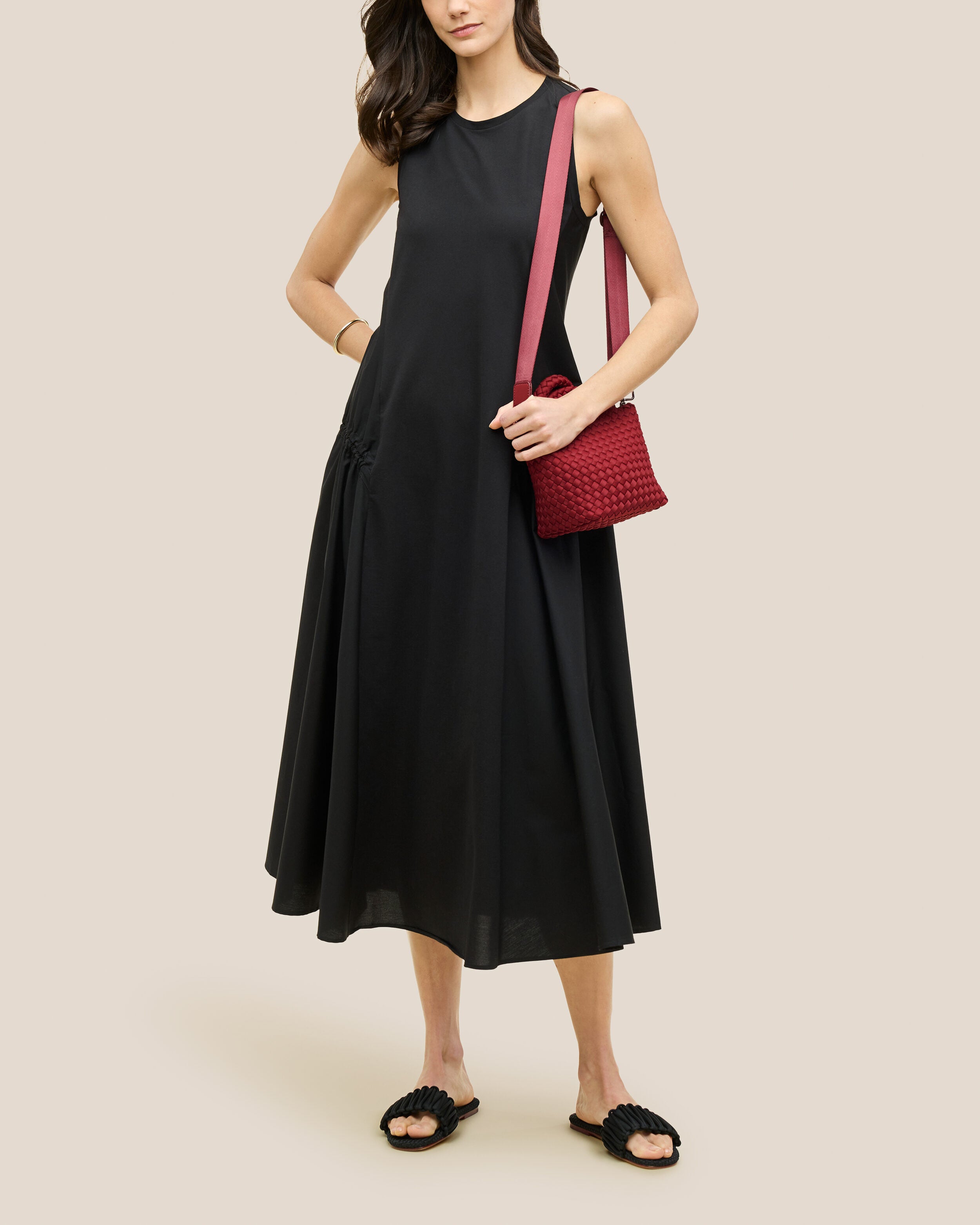 St. Barths Tote in Rosso shown on model to illustrate scale and soft silhouette.