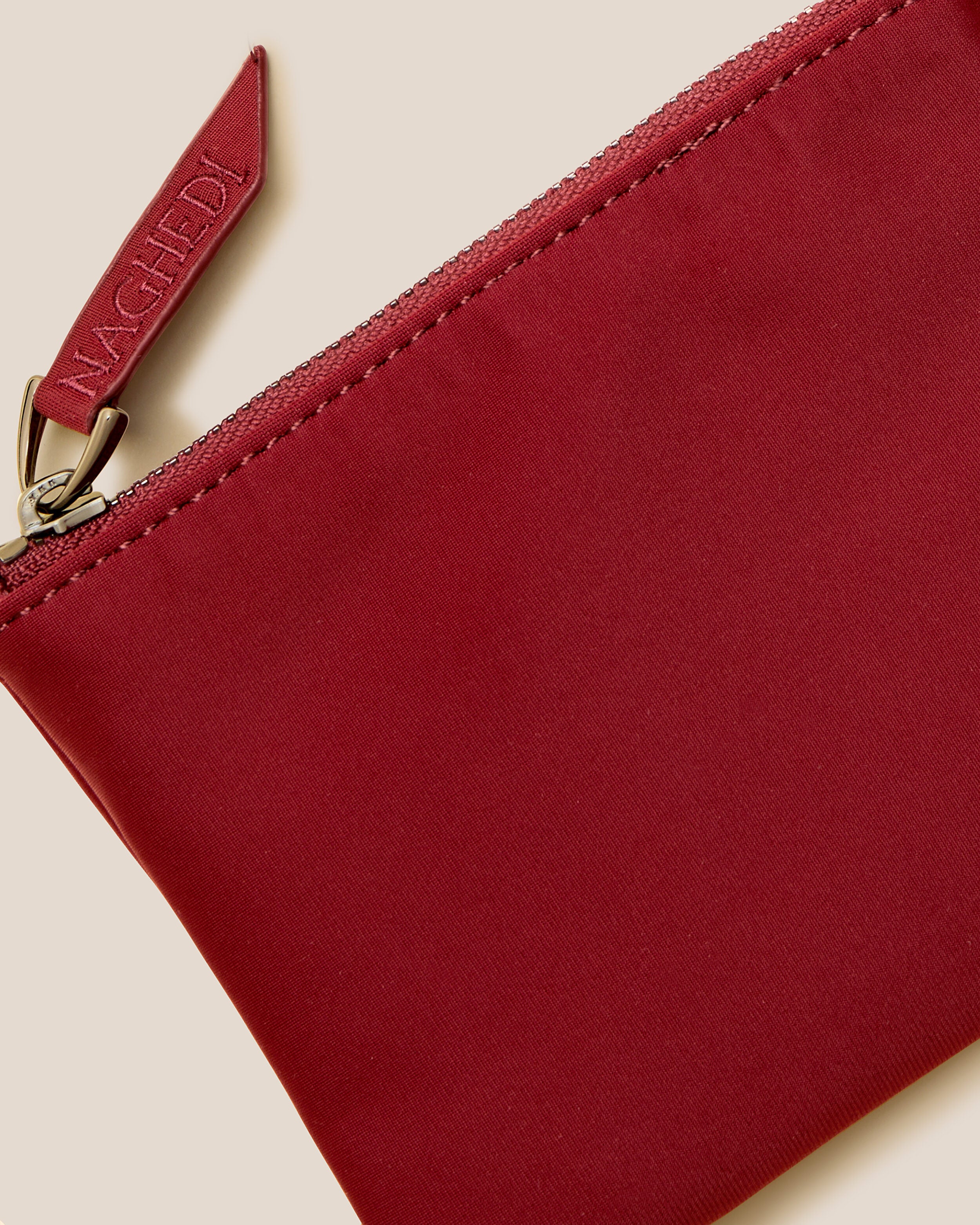 Close-up of included coordinating neoprene zippered pouch.