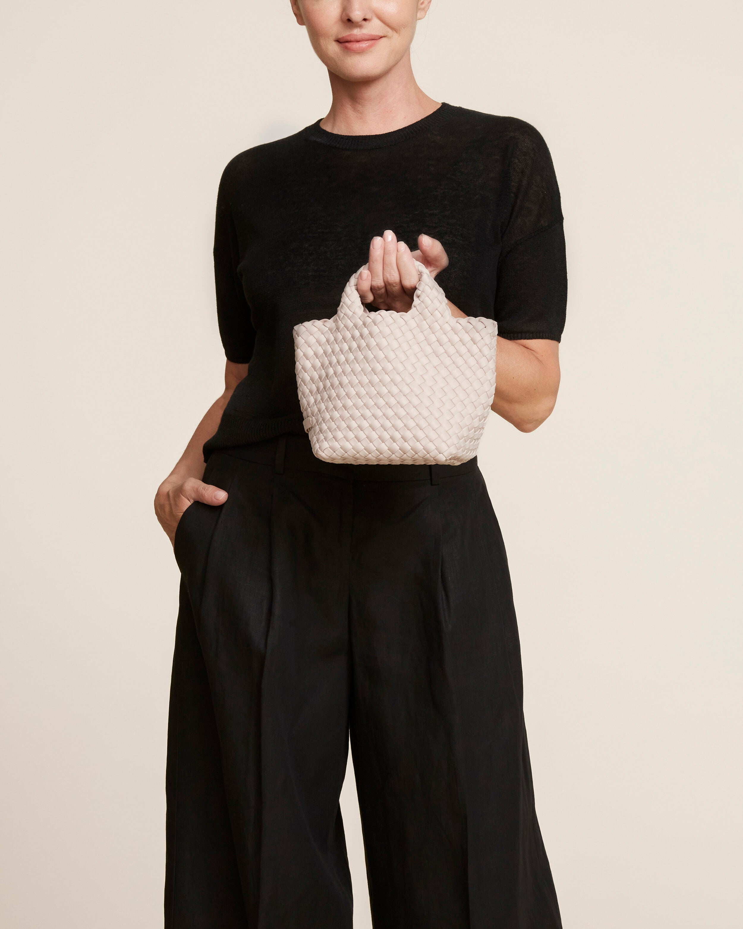 St. Barths Tote in Shell Pink shown on model to illustrate scale and soft silhouette.