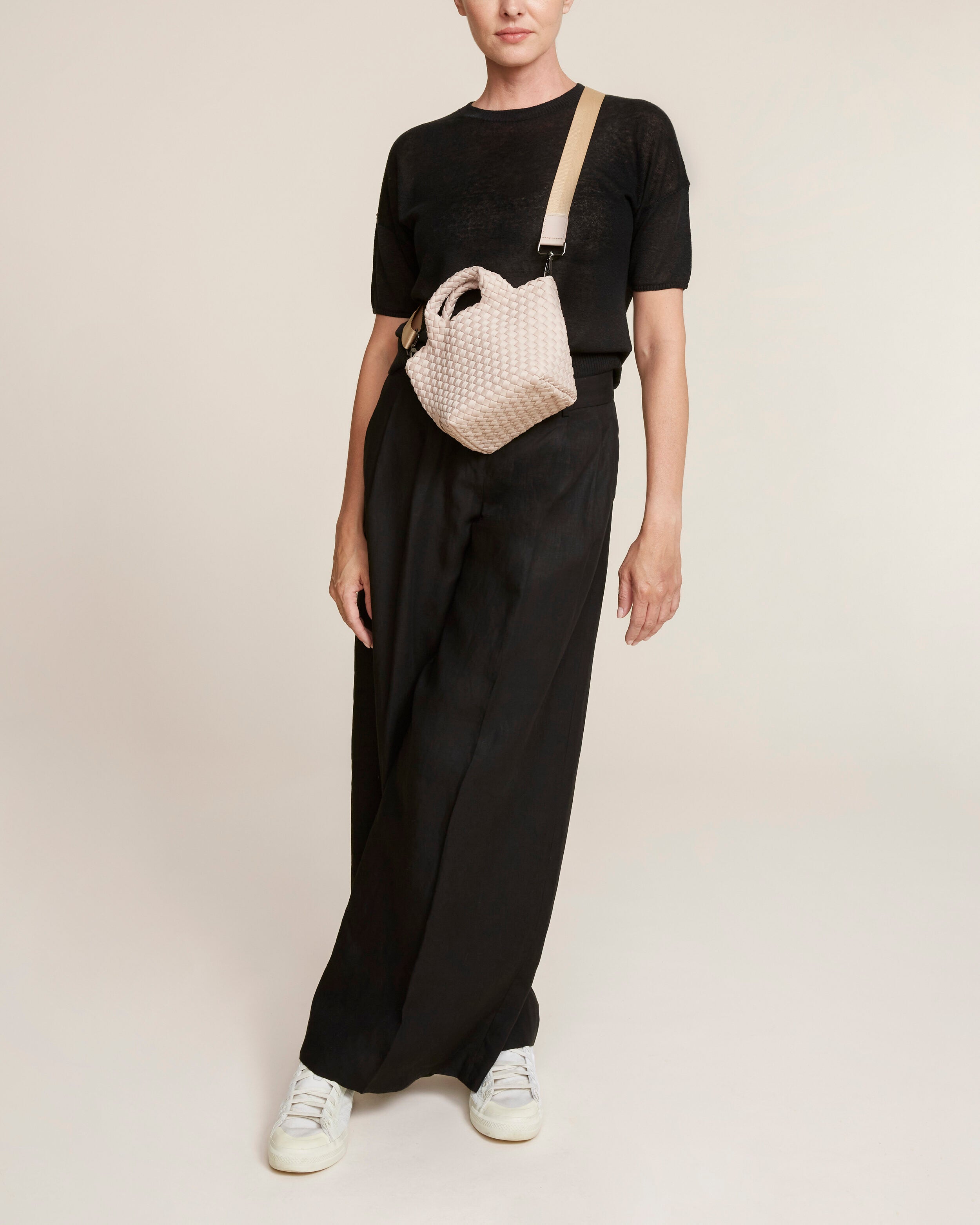 St. Barths Tote in Shell Pink shown on model to illustrate scale and soft silhouette.