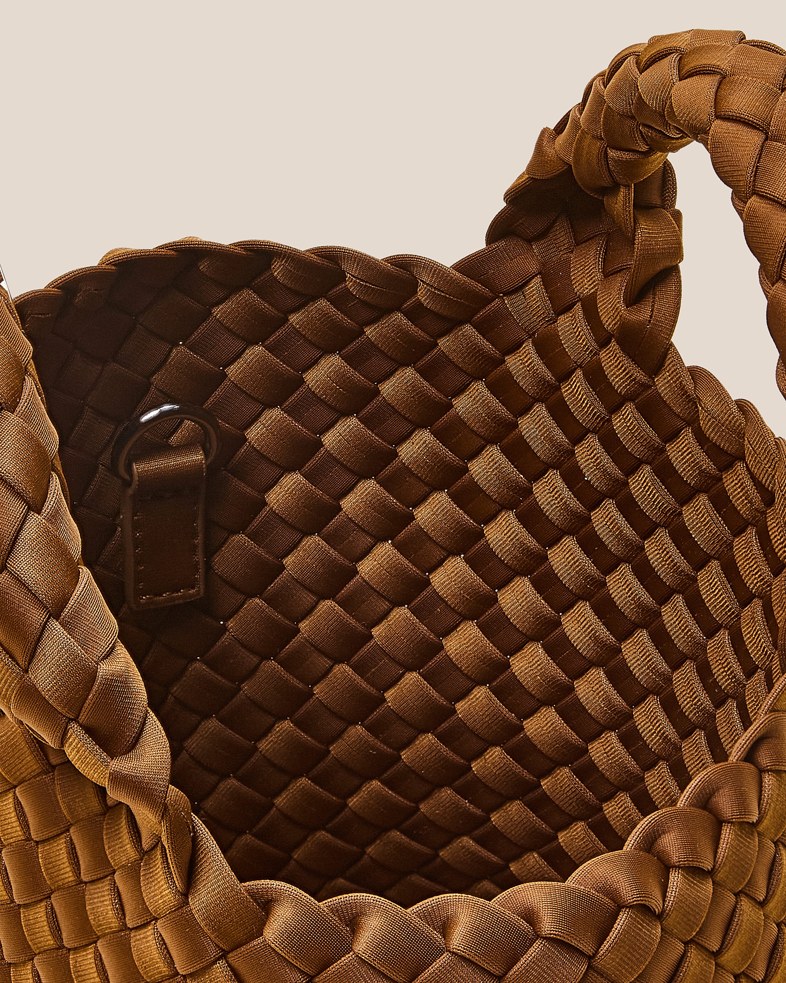 Interior close-up of St. Barths Tote in Teak showing its open top, and unlined interior.