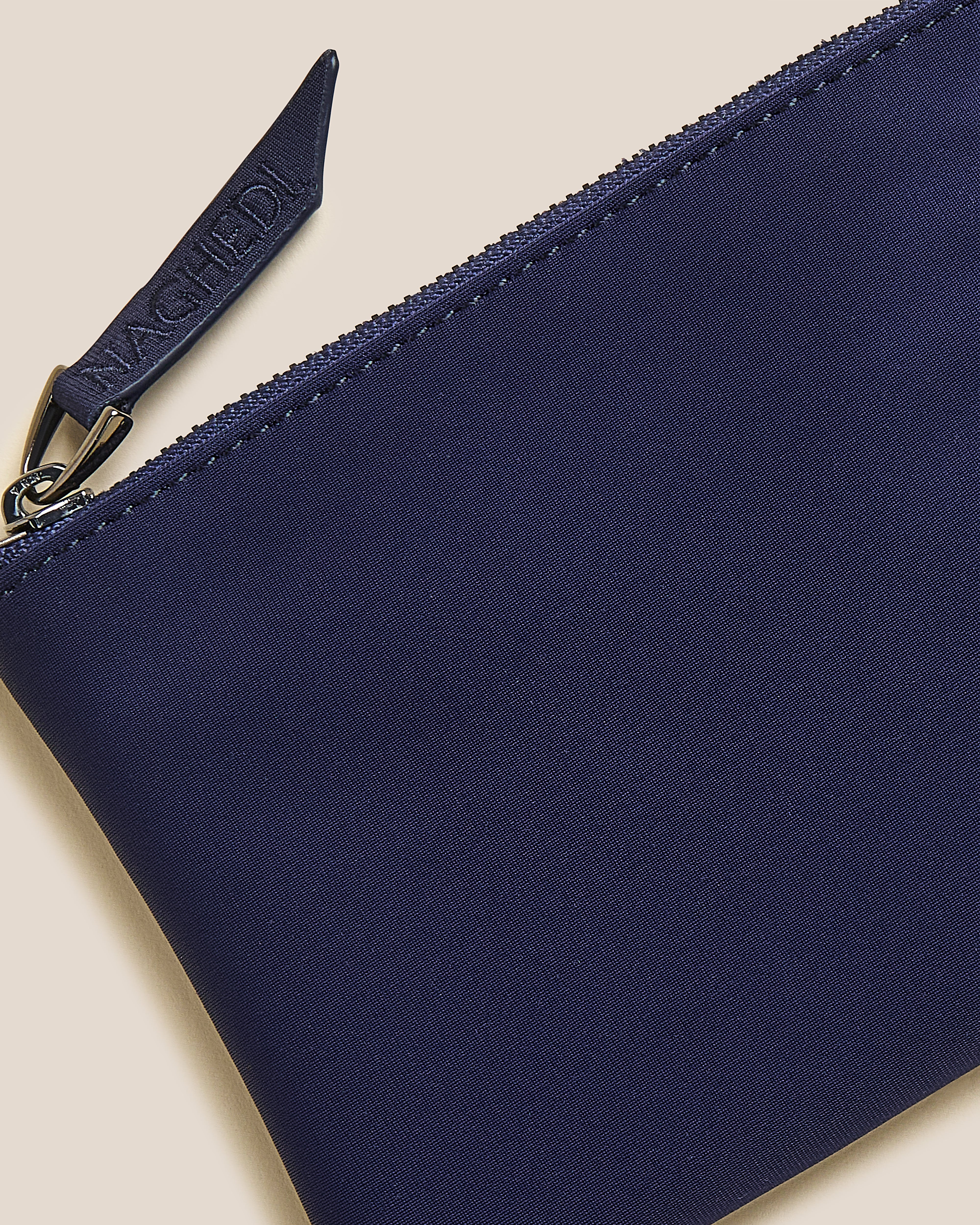 Close-up of included coordinating neoprene zippered pouch.
