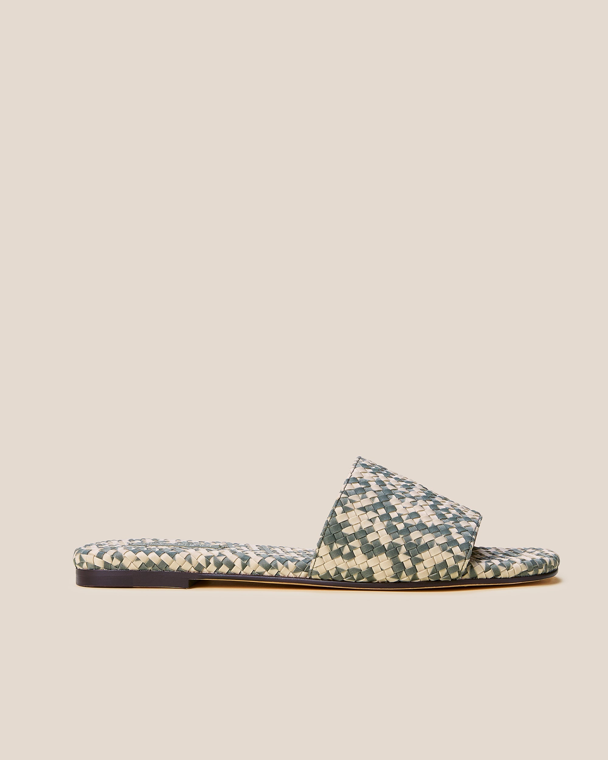 Side view of St. Barths Prism Slide Sandals in Papyrus, a cream and light olive green tone, featuring an open toe and square silhouette.